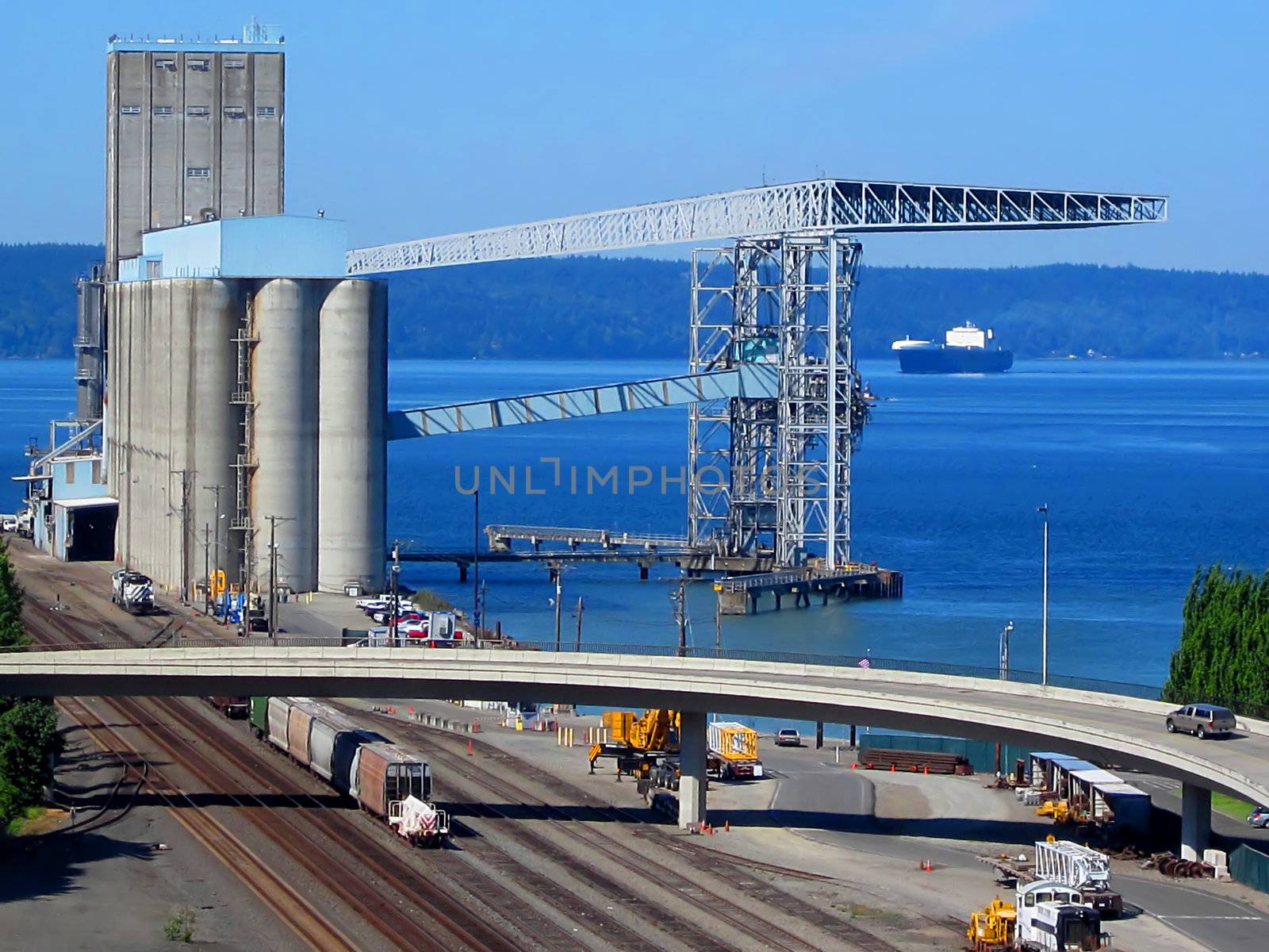 A photograph of a grain storage facility where grain is loaded and unloaded from ships.