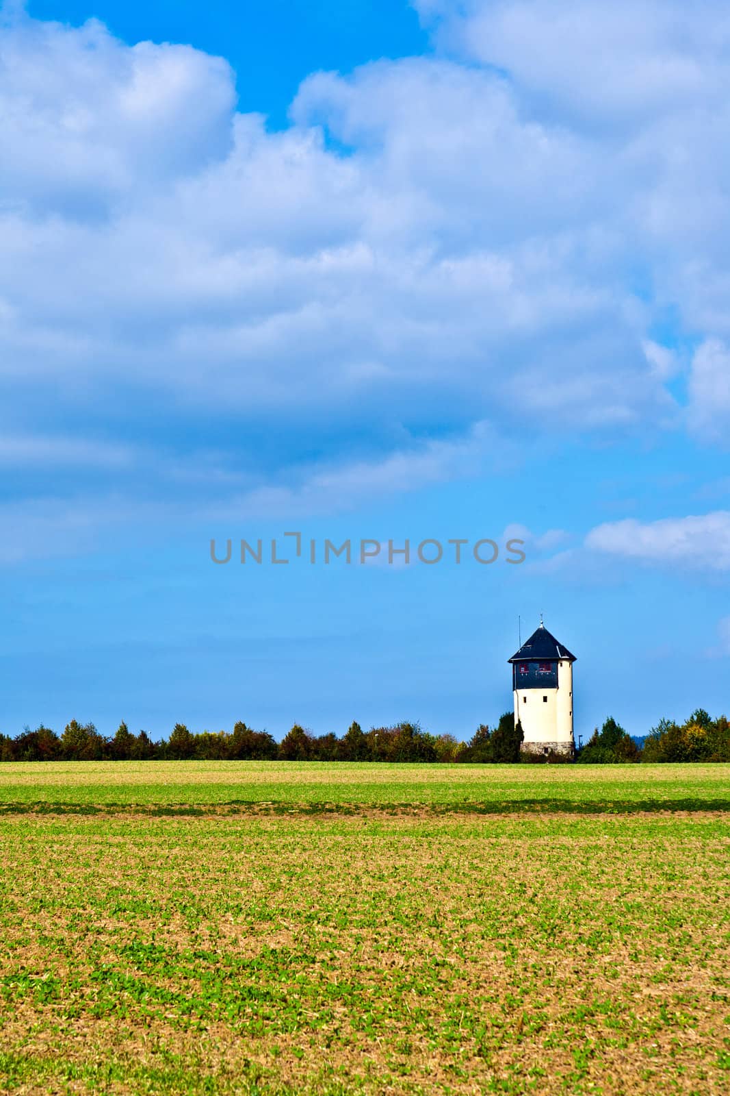 settlement beside an old watertower by meinzahn