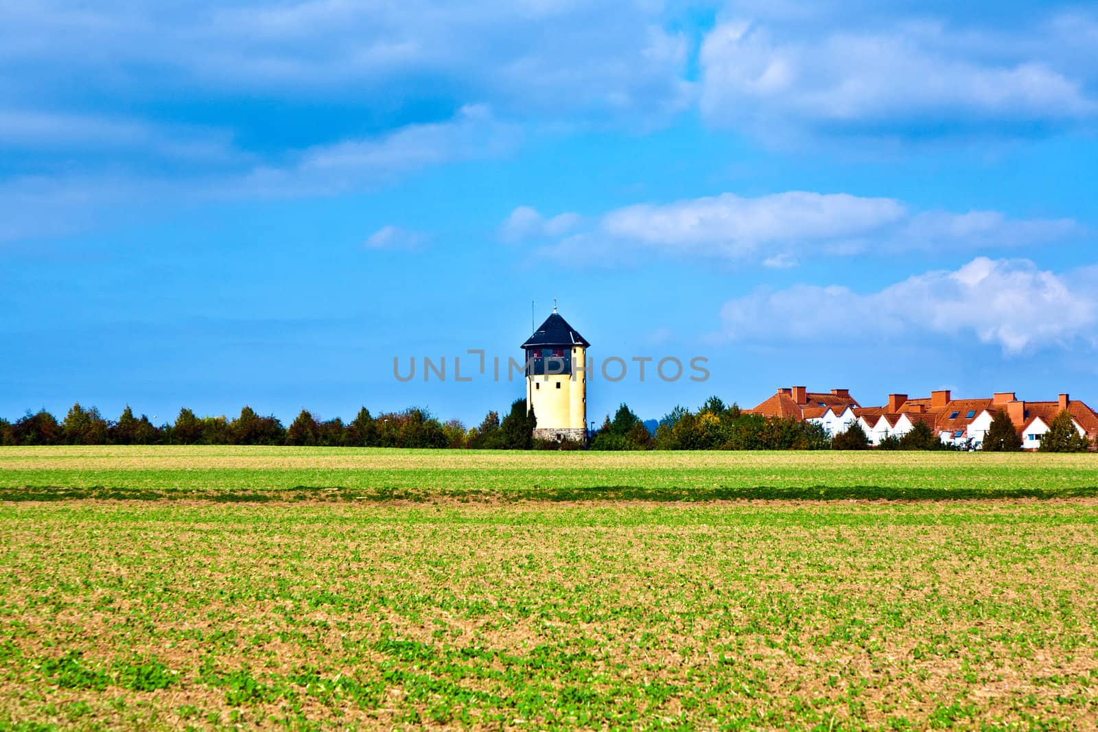 settlement beside an old watertower by meinzahn