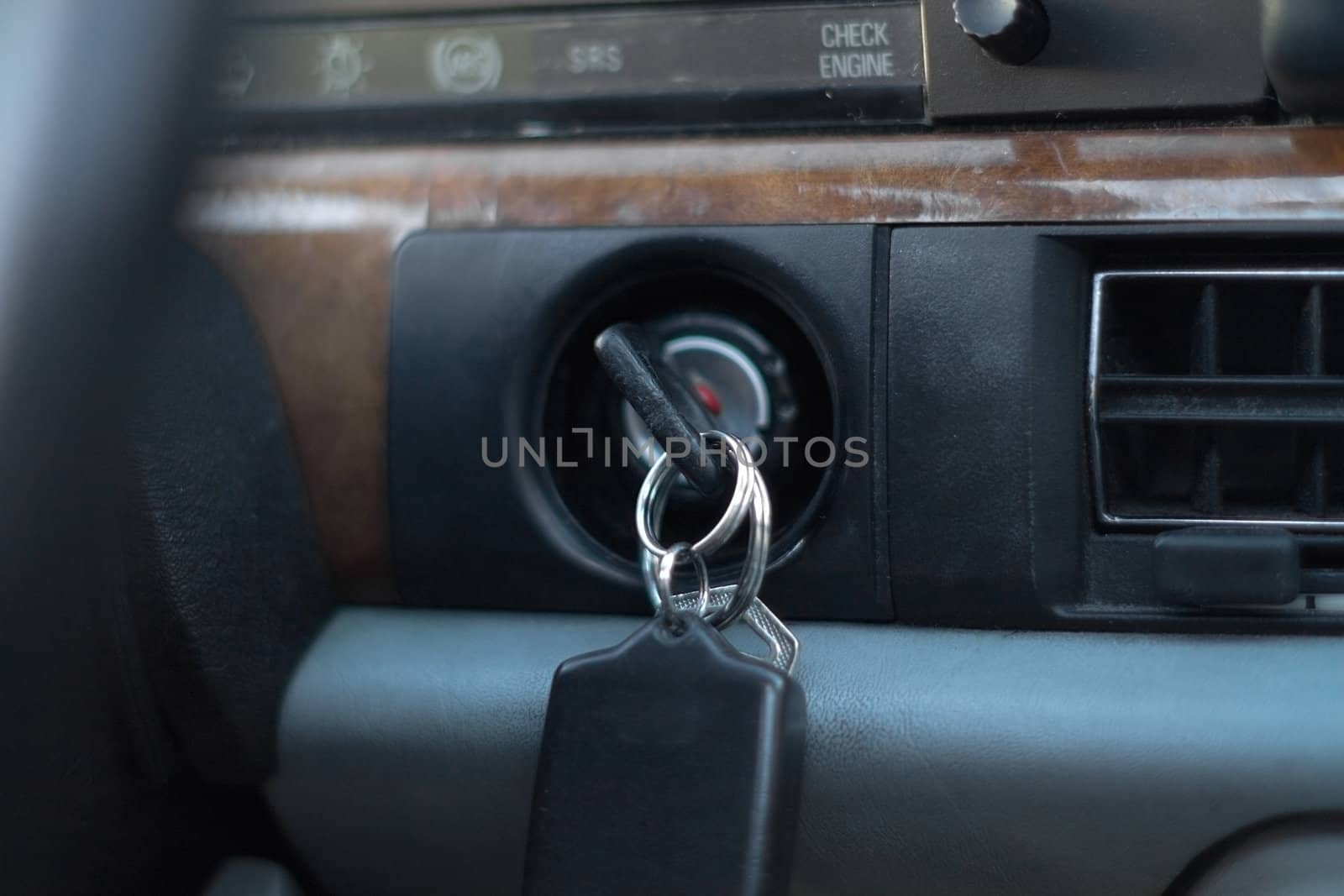 car keys in ignition on luxury car