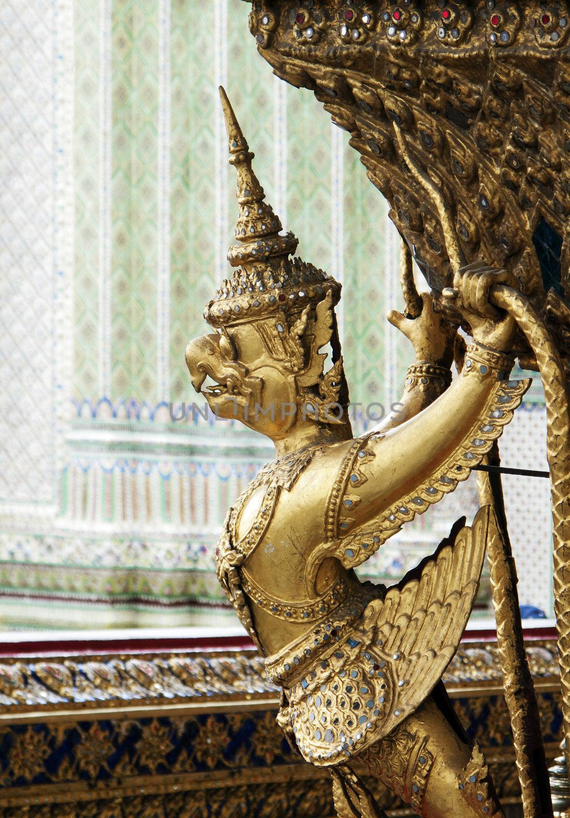 statue in grand palace bangkok thailand by jackmalipan