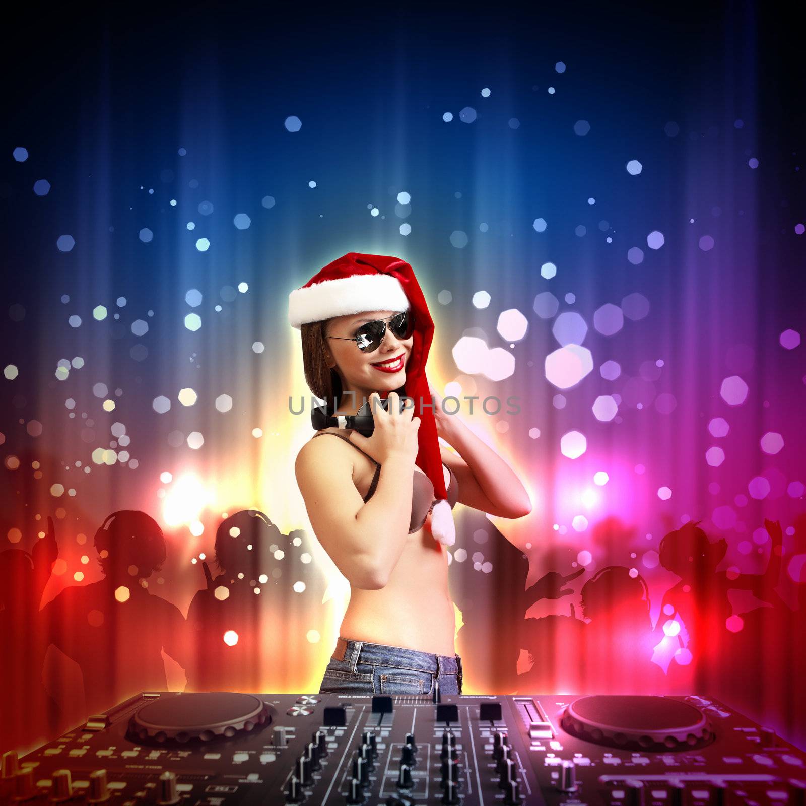 Young brunette woman in christmas wear with earphones
