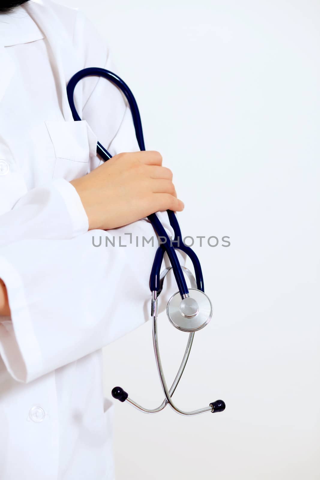 Portrait of happy successful young female doctor holding a stethoscope