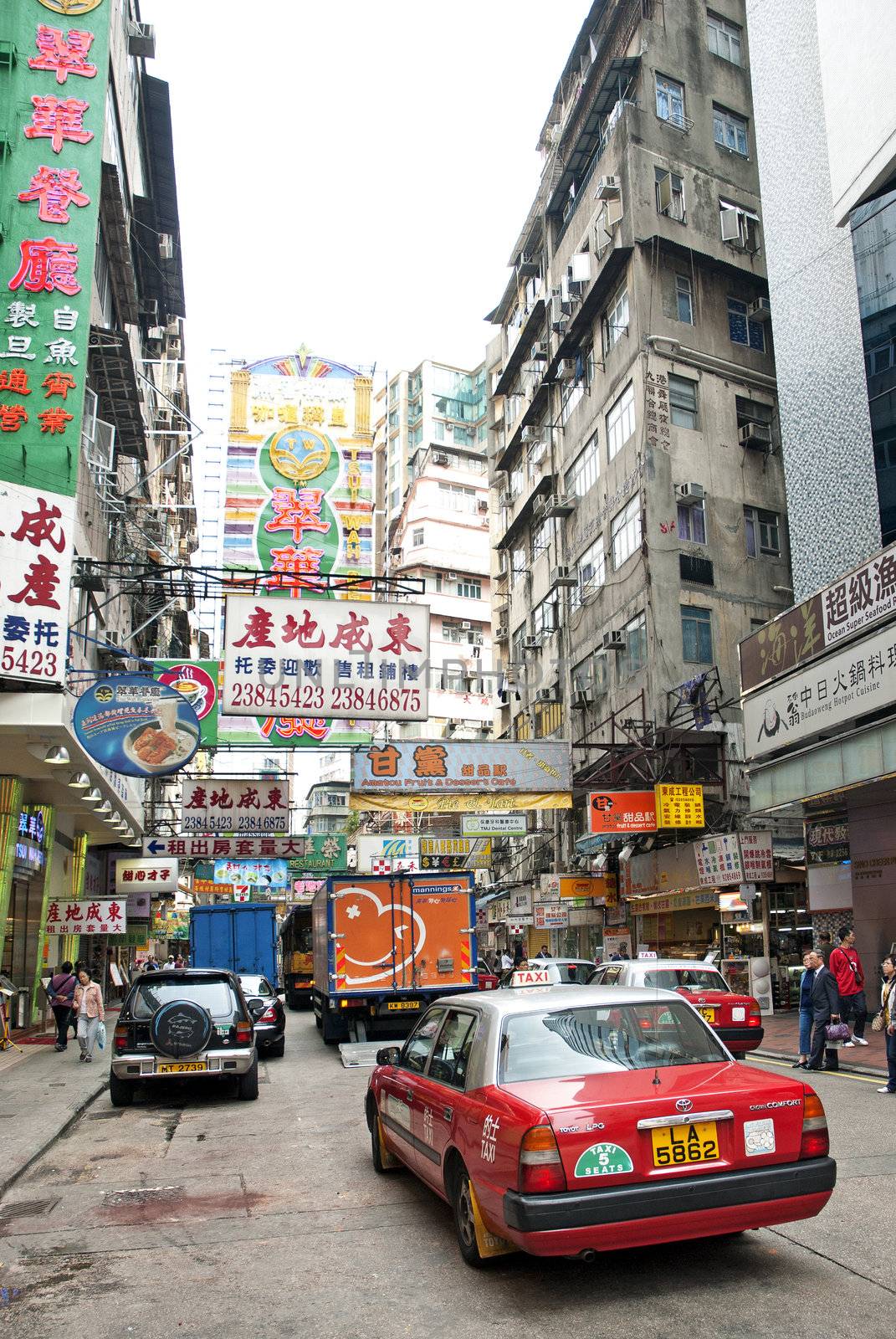 hong kong city center street with taxi by jackmalipan