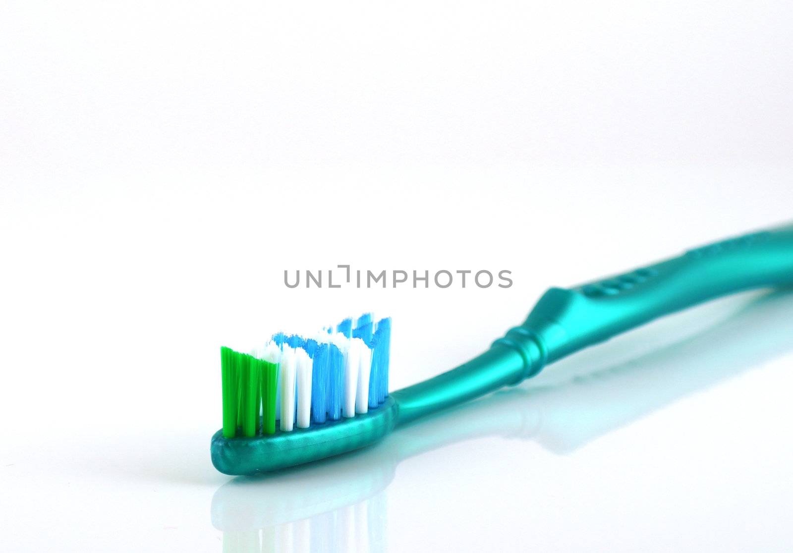 Tooth-brush over white. Shallow DOF.