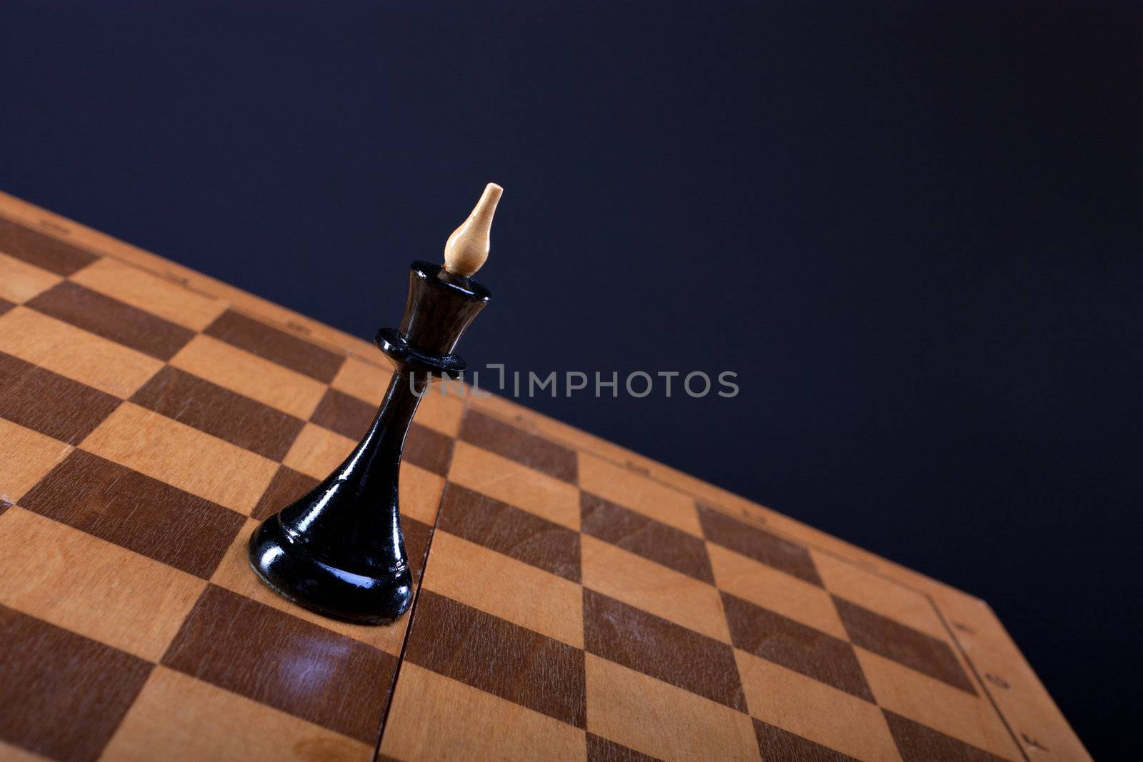 chess queen on the Board dark background