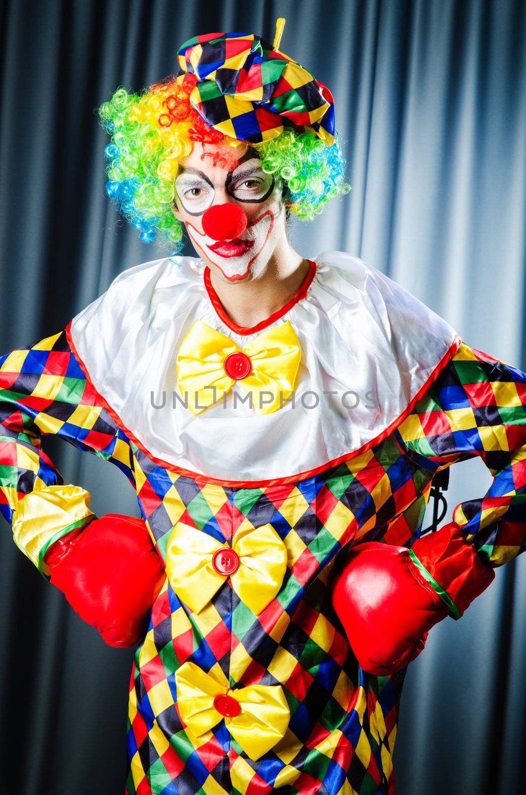 Funny clown in the studio shooting