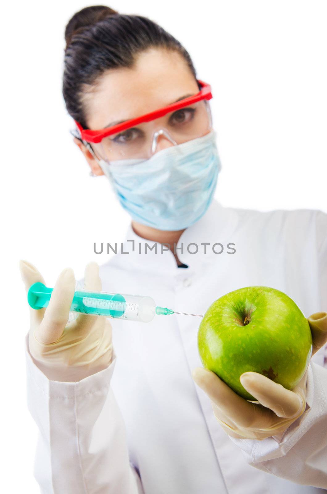 Chemical experiment with apple and syringe