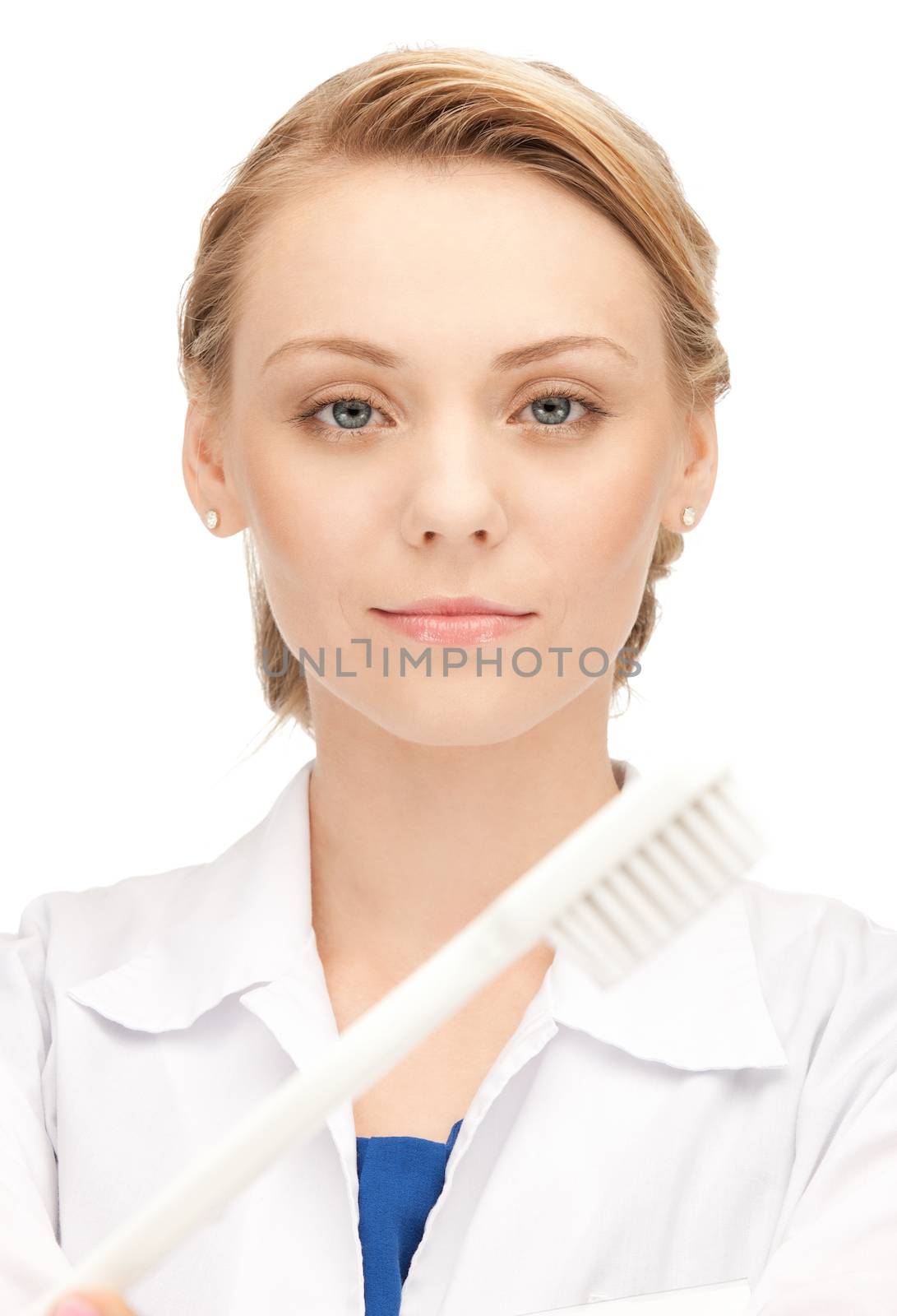 attractive female doctor with toothbrush by dolgachov