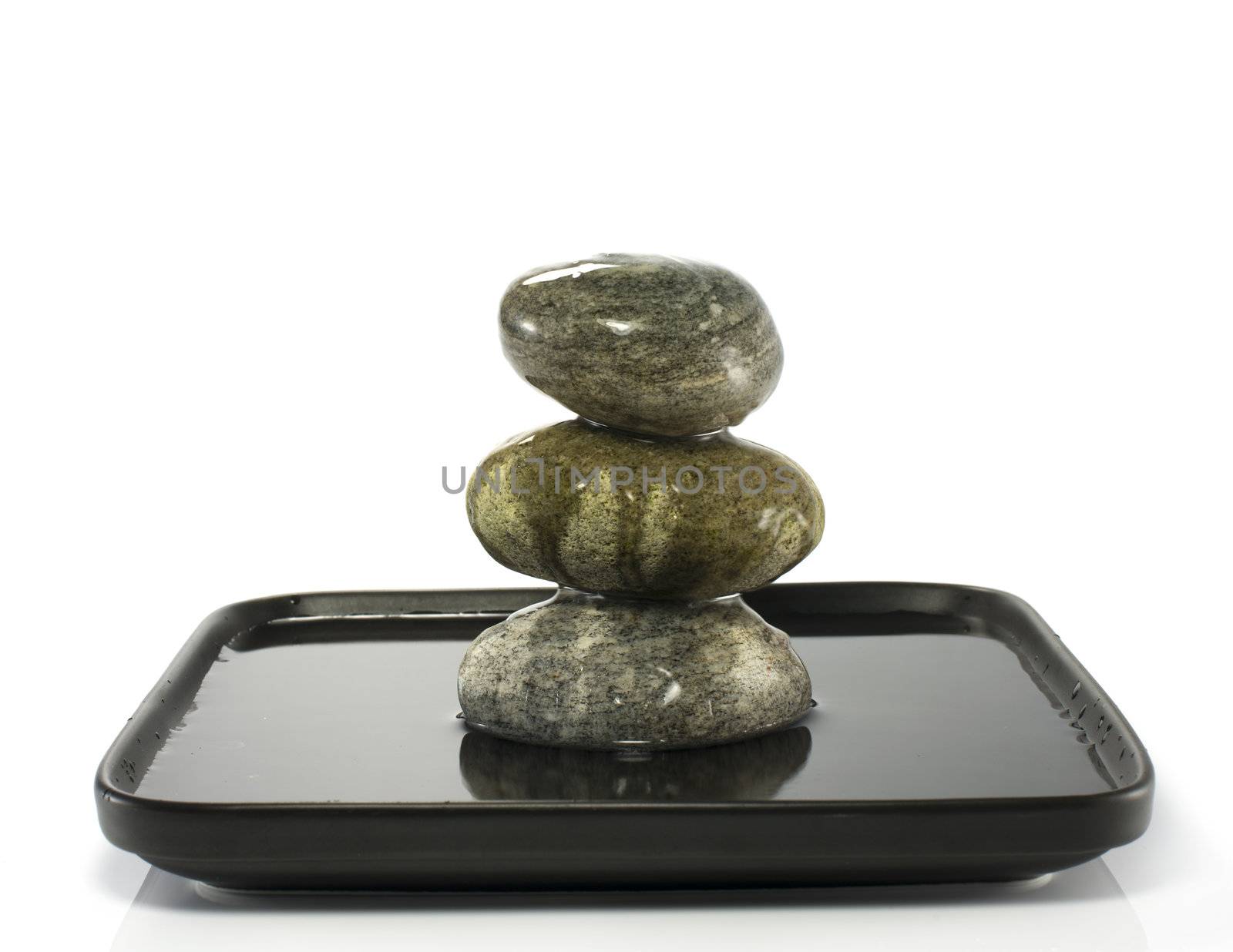 three stones in balance with water
