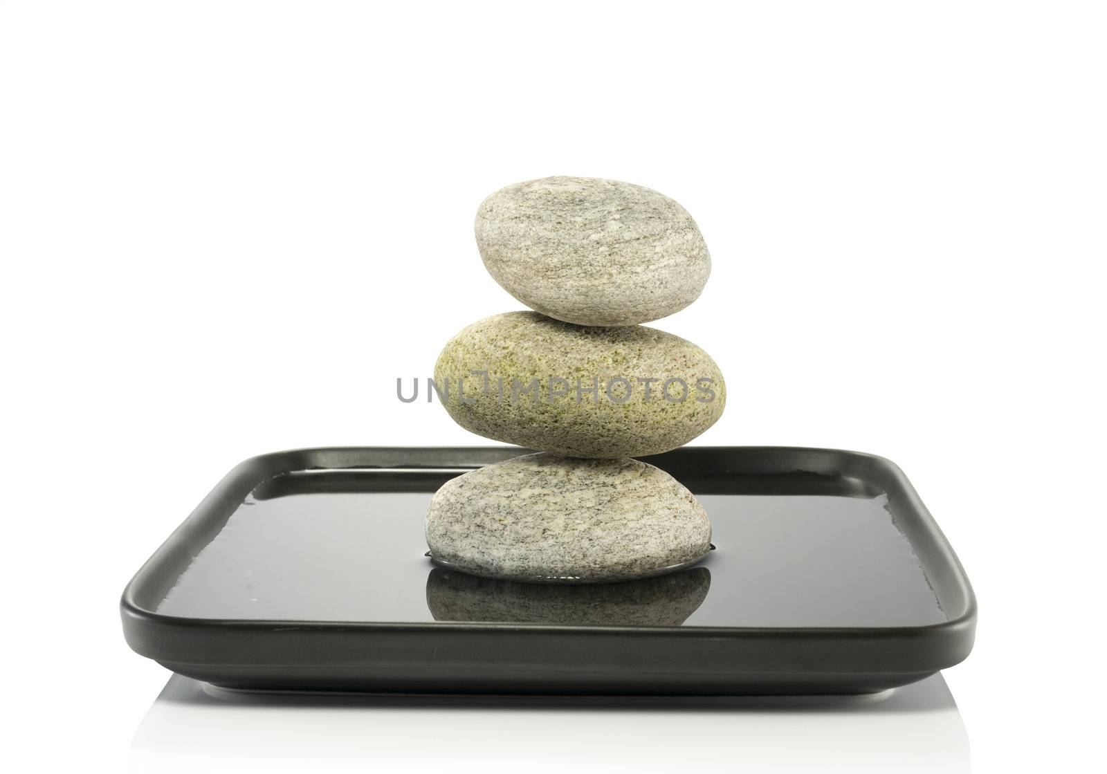 tower of stones in  balance in water
