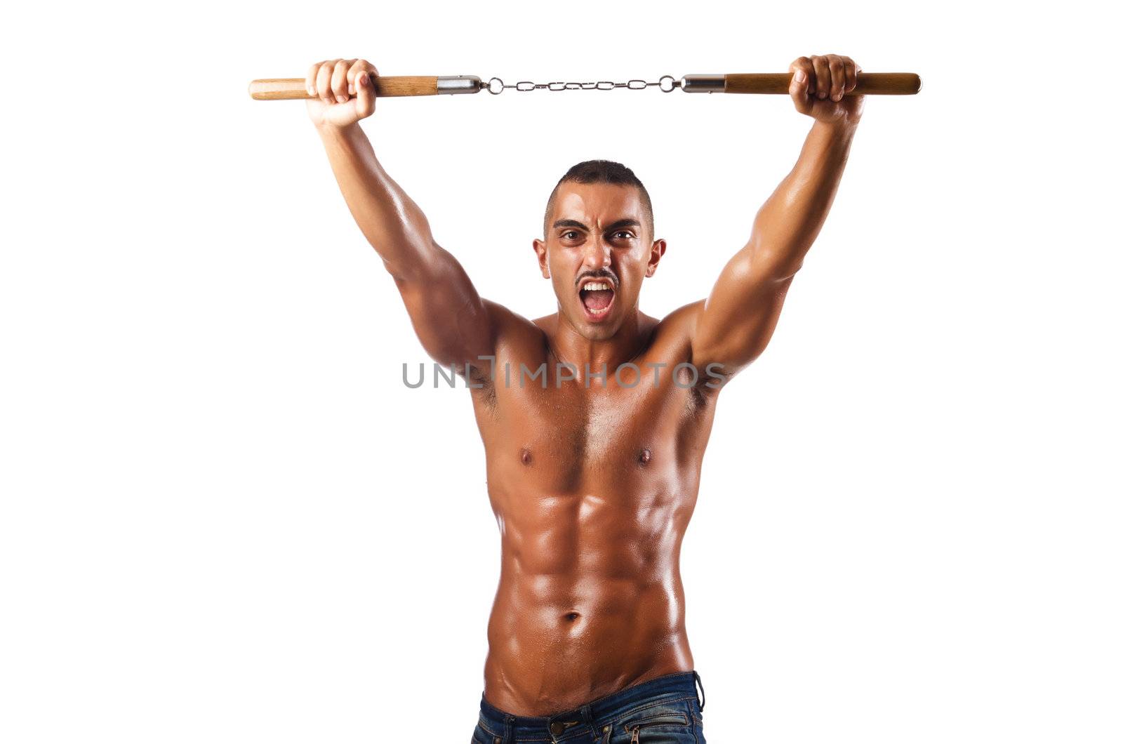 Man in martial arts concept with nunchucks