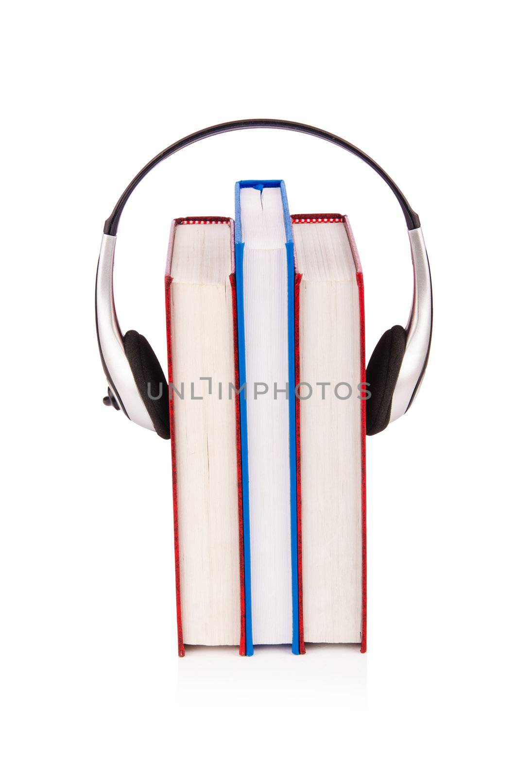 Concept of audio books with earphones on white