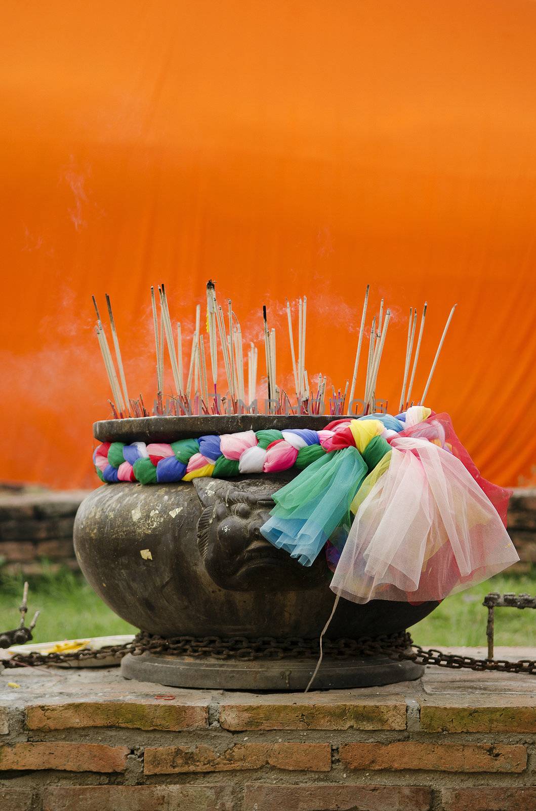 incense at buddhist temple in thailand