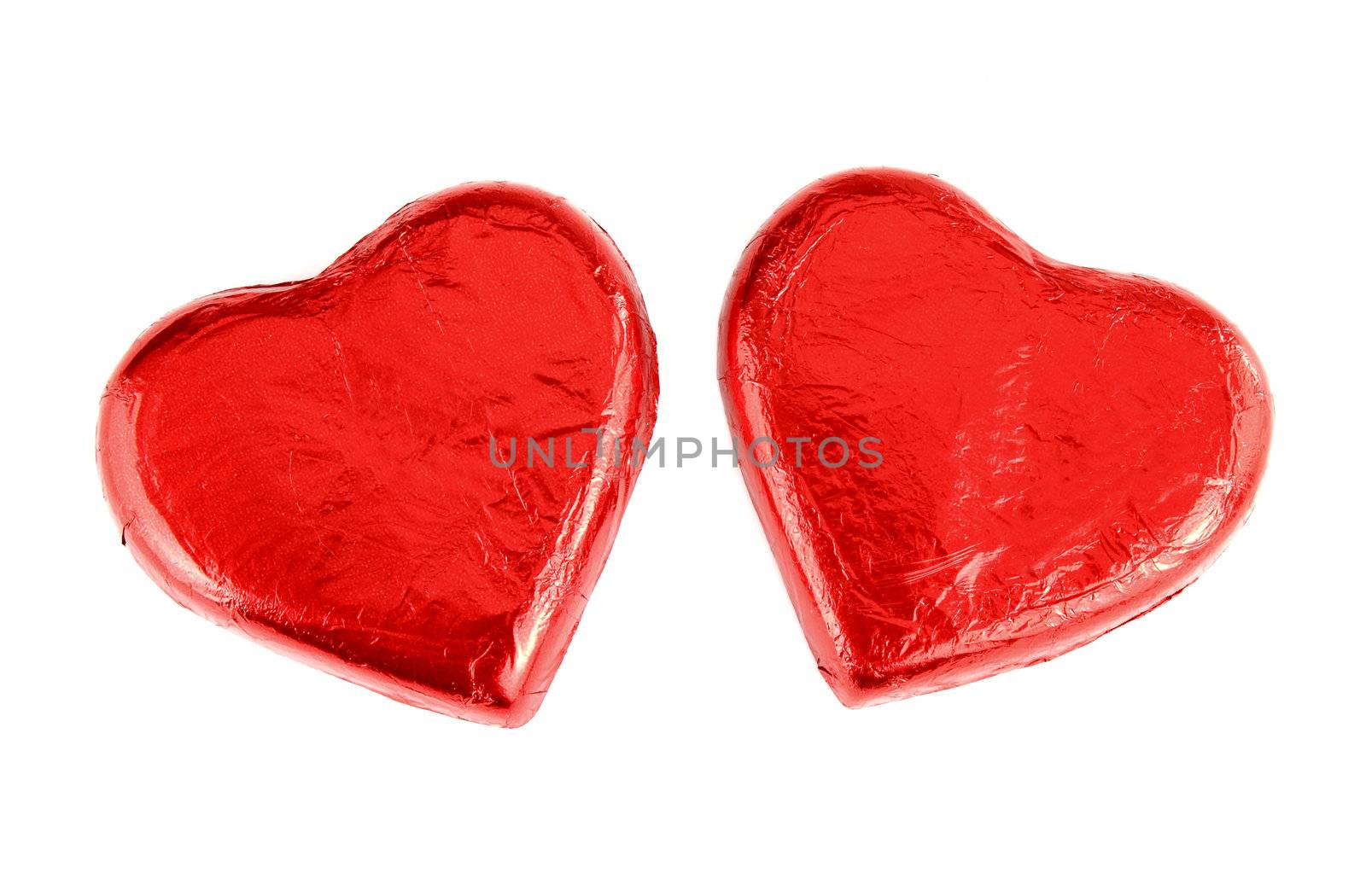 Red Foil wrapped chocolate hearts by geargodz