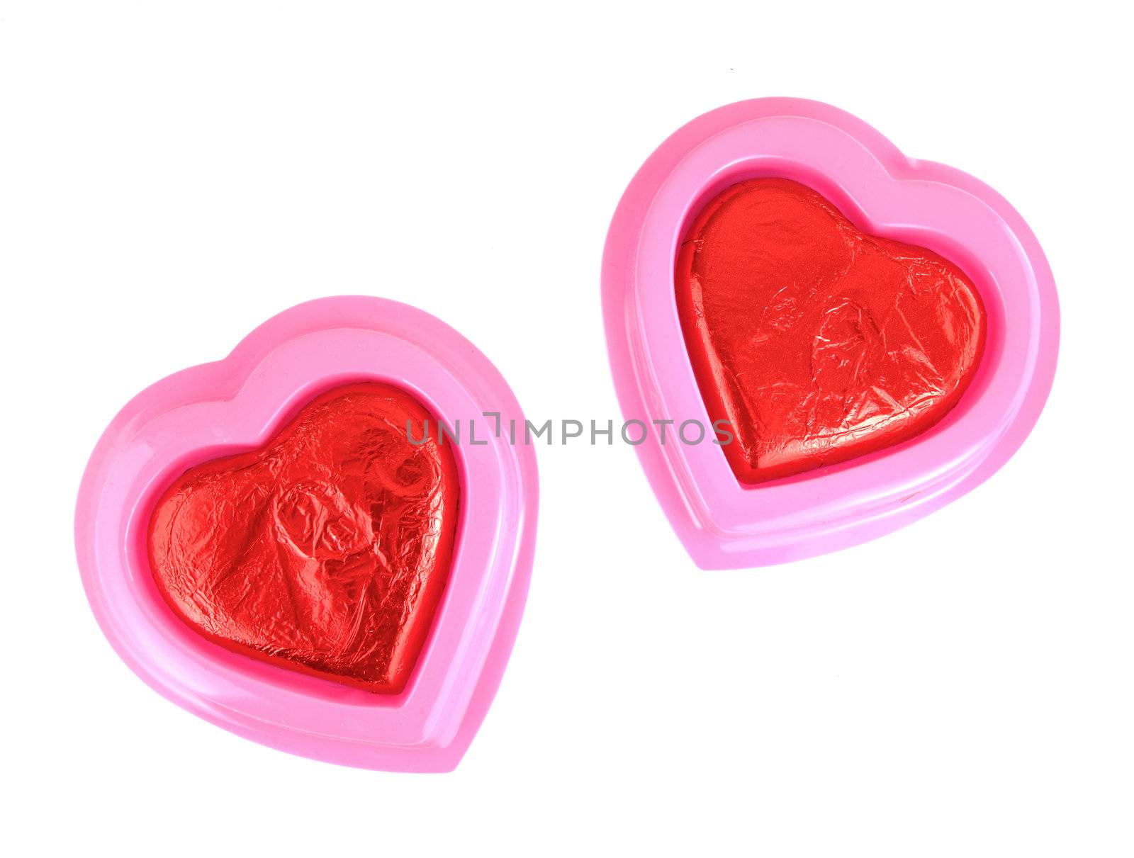 Red Foil wrapped chocolate hearts by geargodz