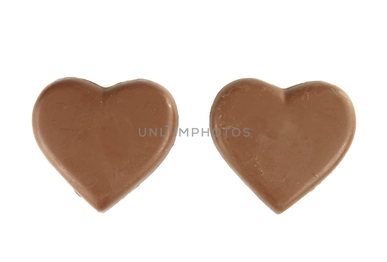 chocolate heart shape on white background by geargodz