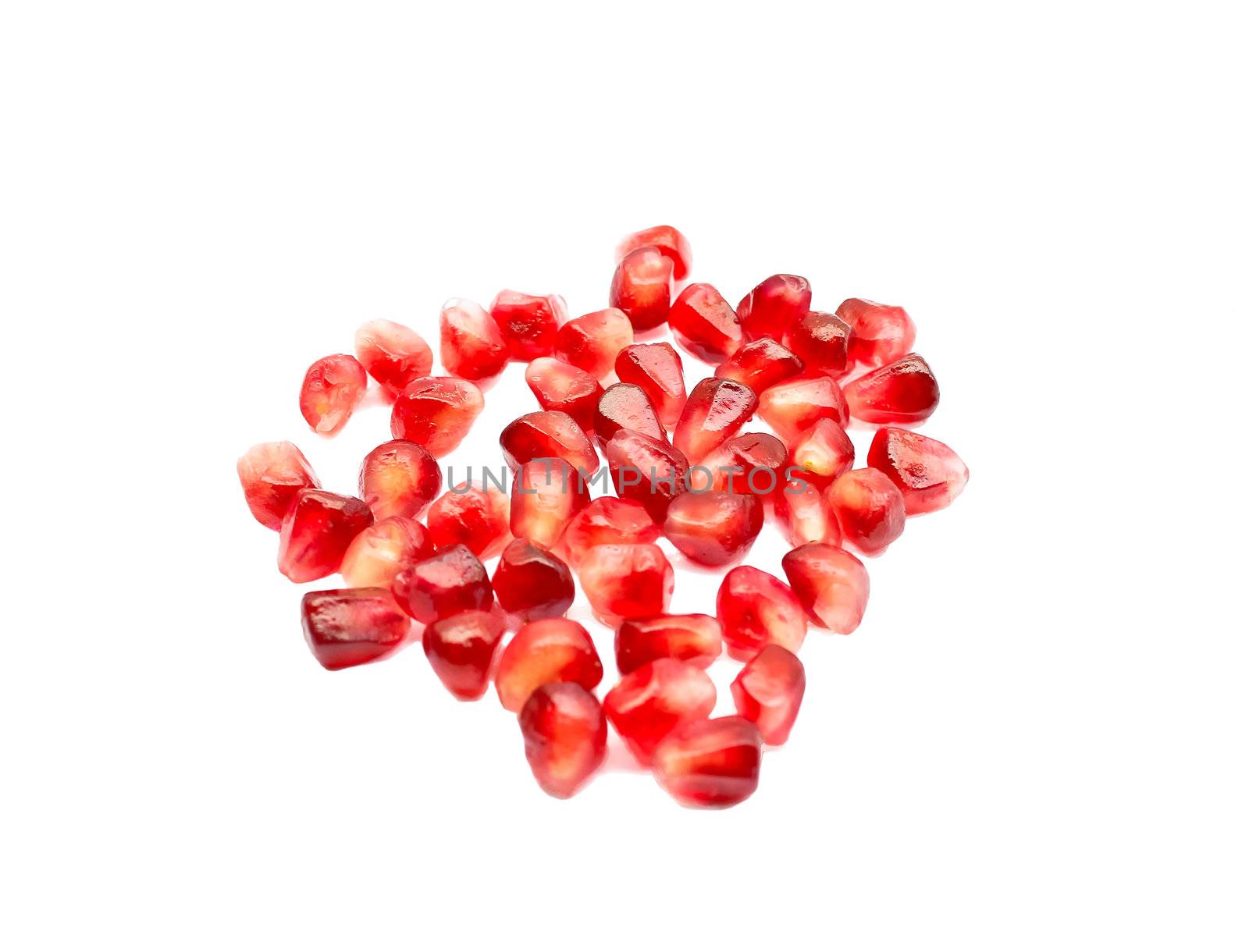 Pomegranate seeds on a white background