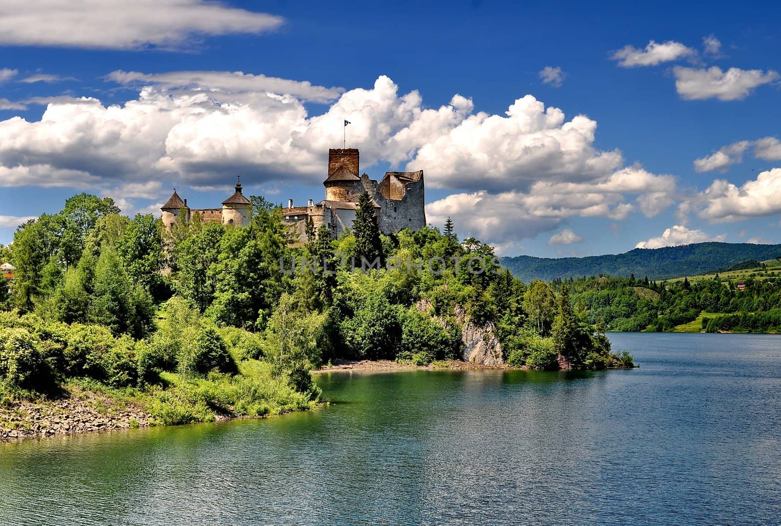 Castle on a hill besides a lake (Nedec, Poland)