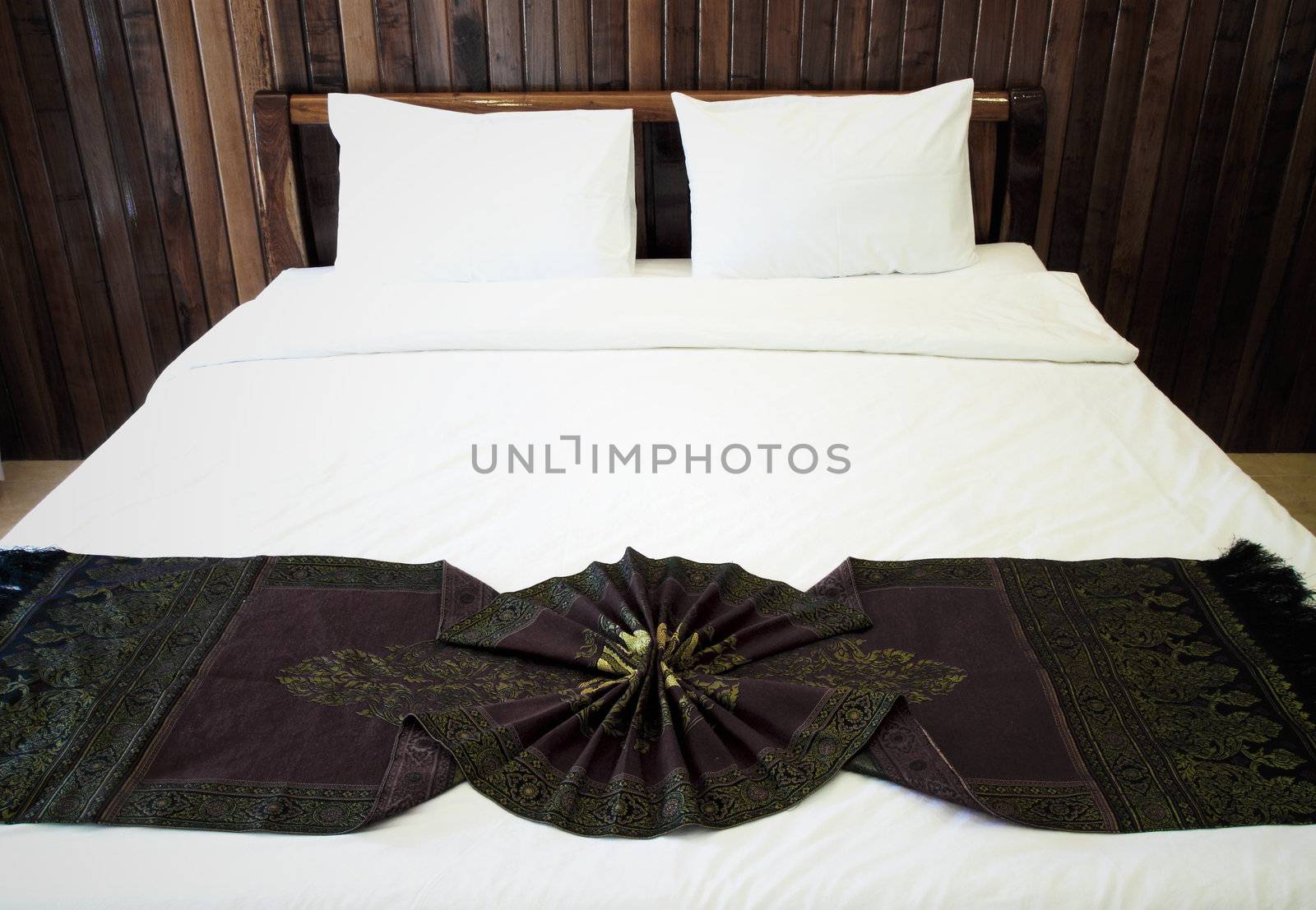 Beautiful double bed in traditional Thai setting