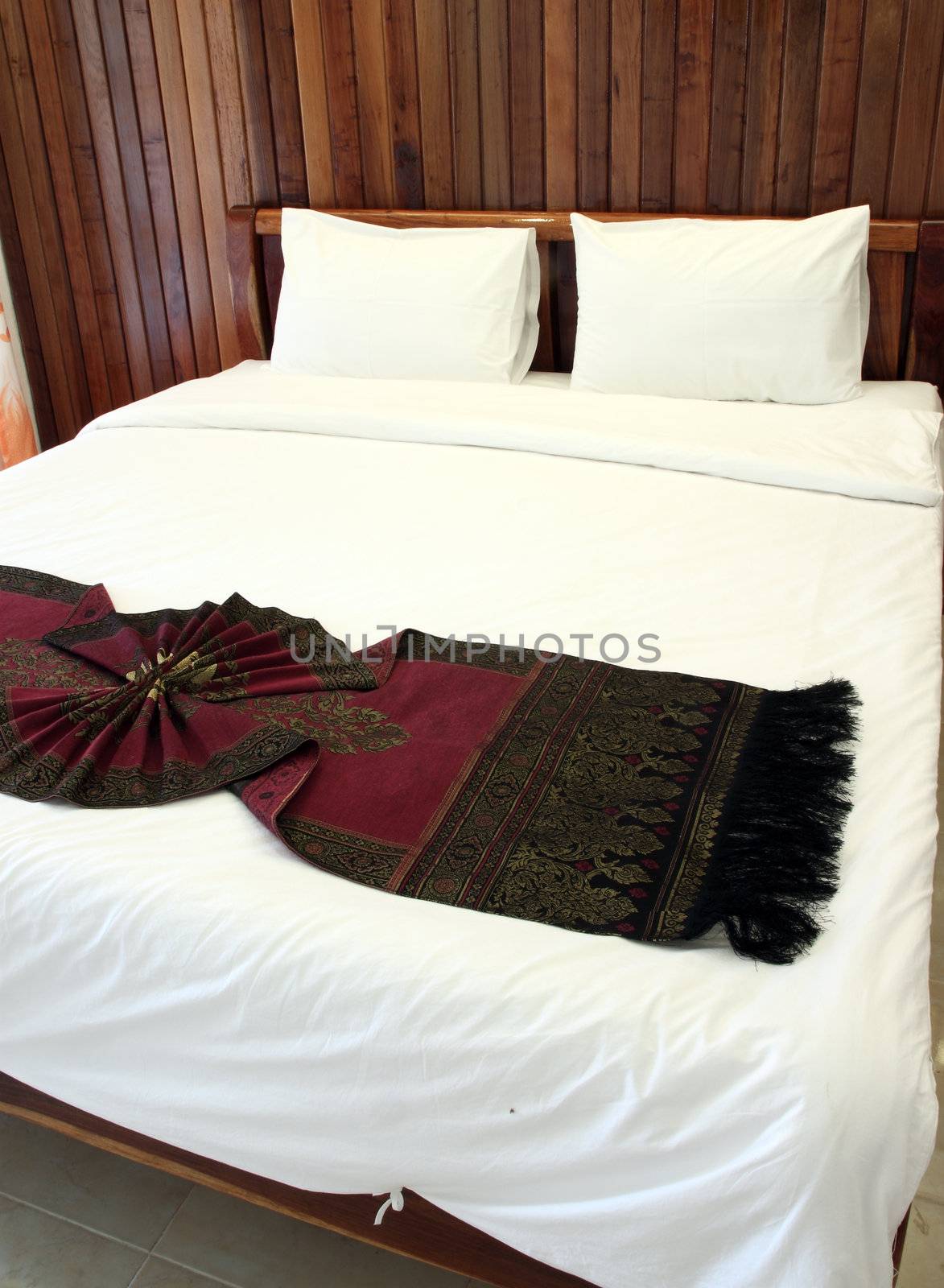 Beautiful double bed in traditional Thai setting