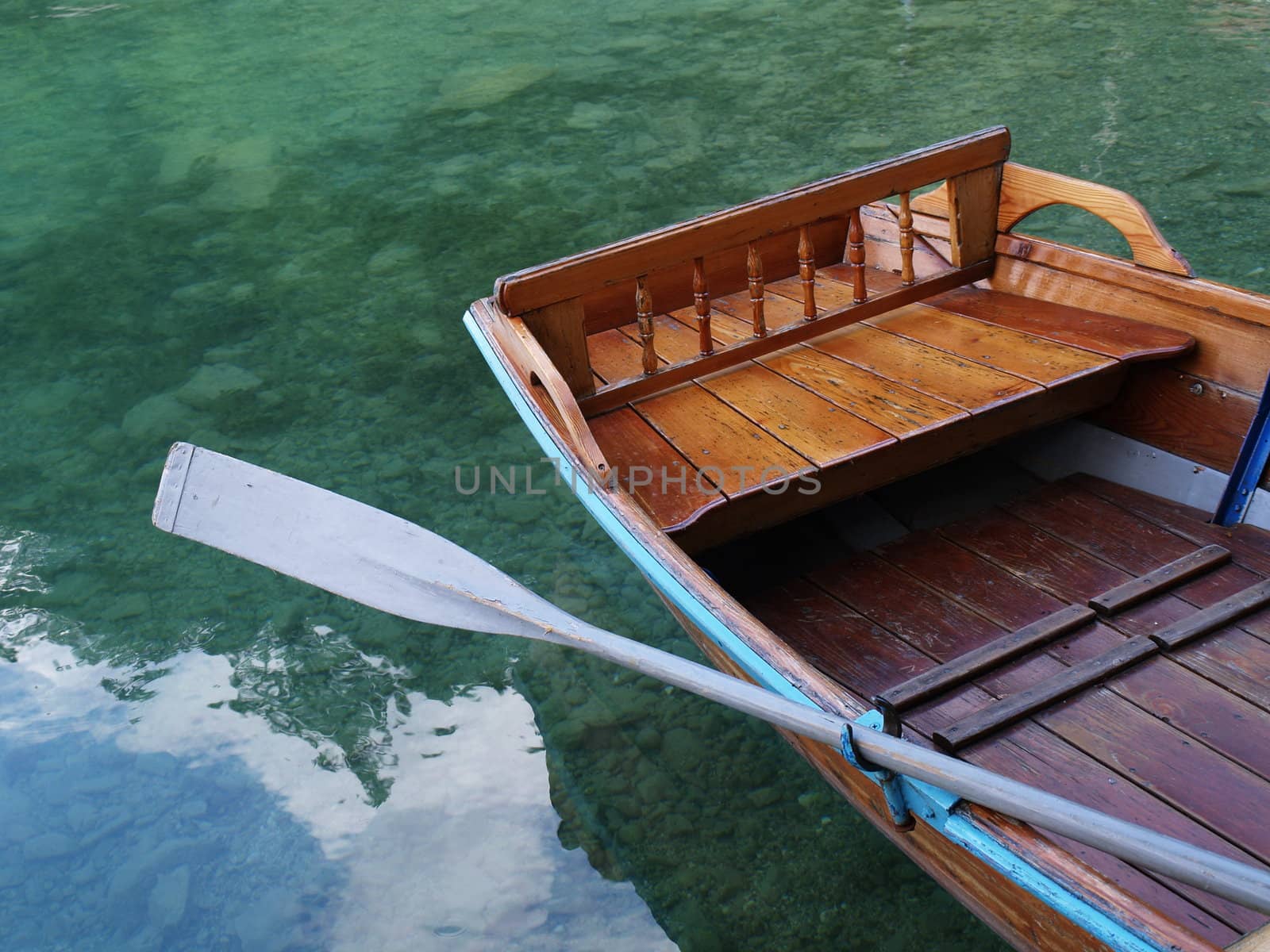 Empty boat on water by anderm