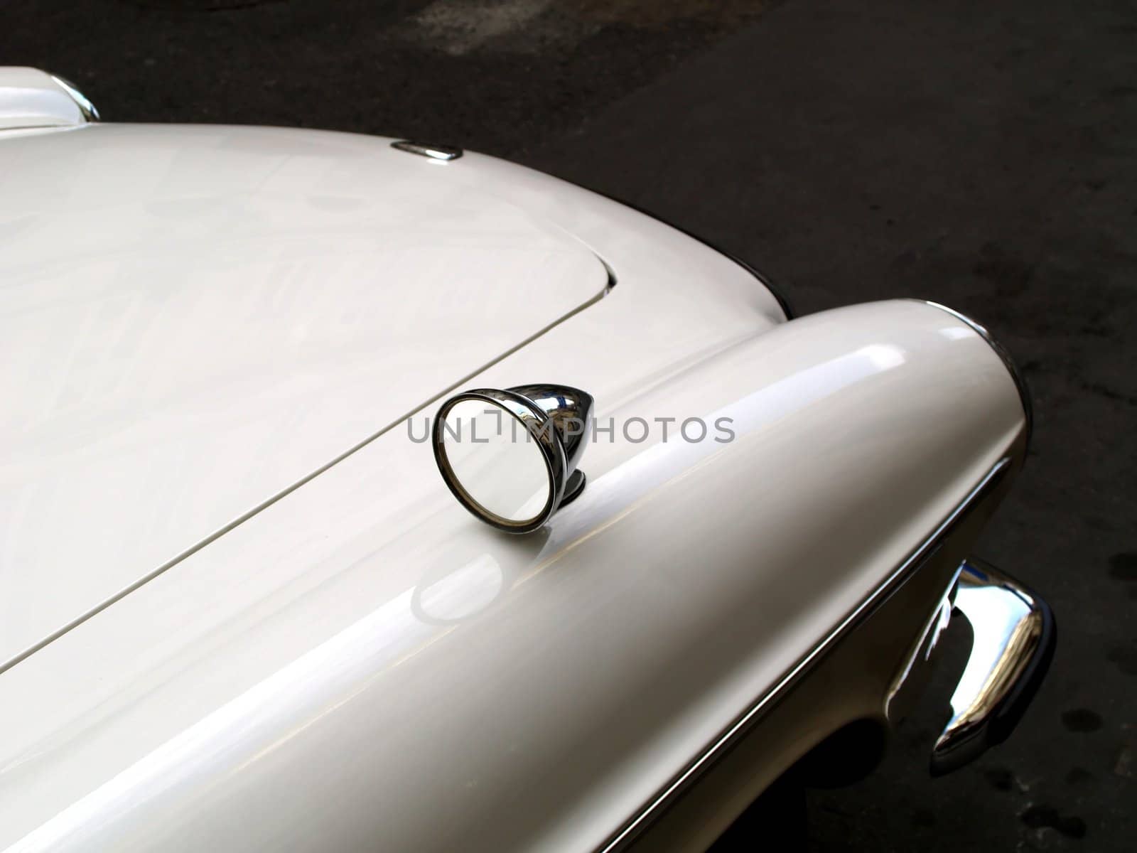 An old white car's hood.