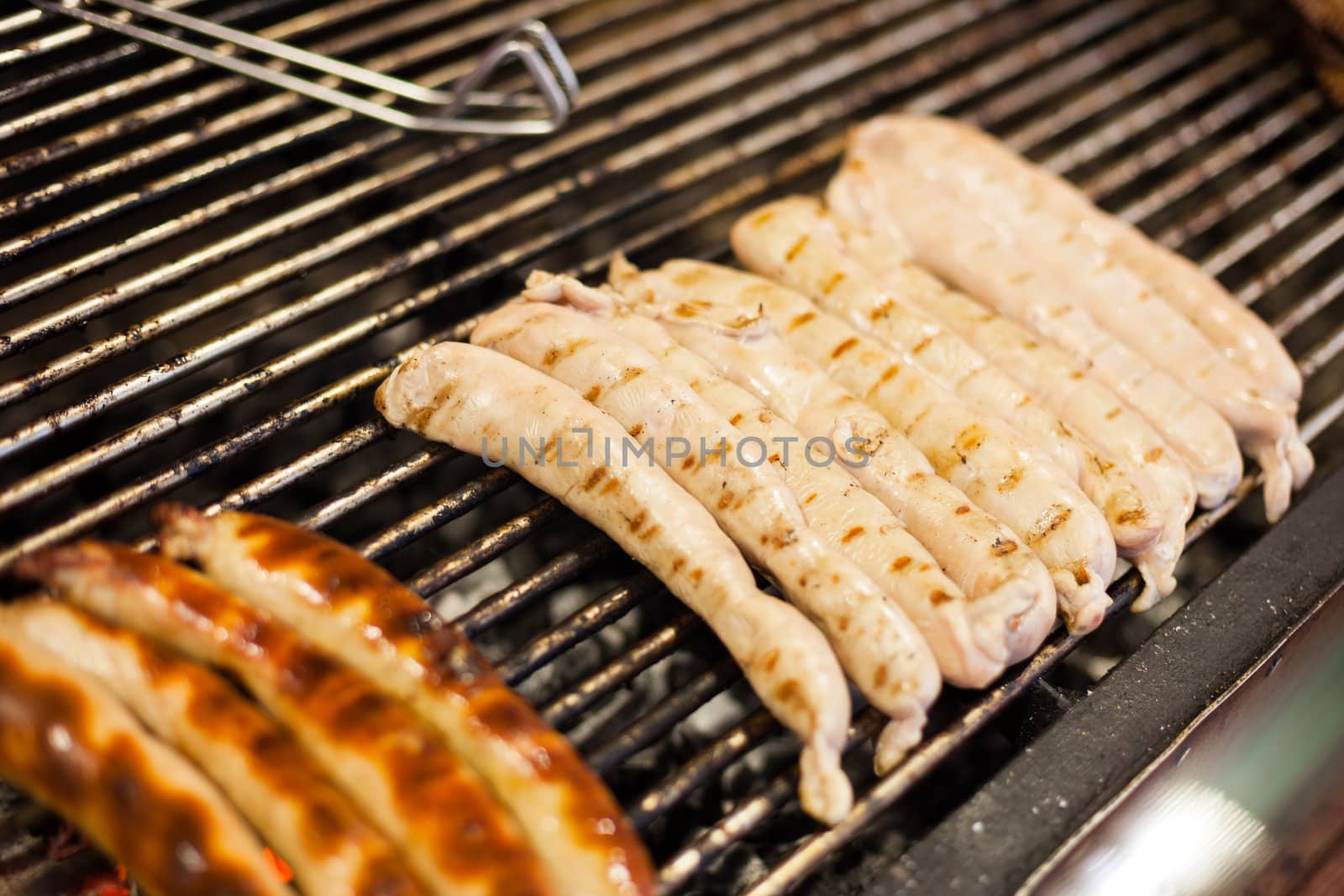 German sausages being grilled over coal outdoors
