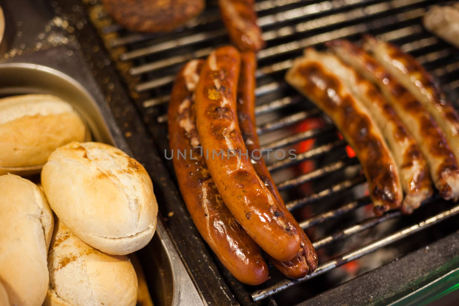 German sausages being grilled over coal outdoors