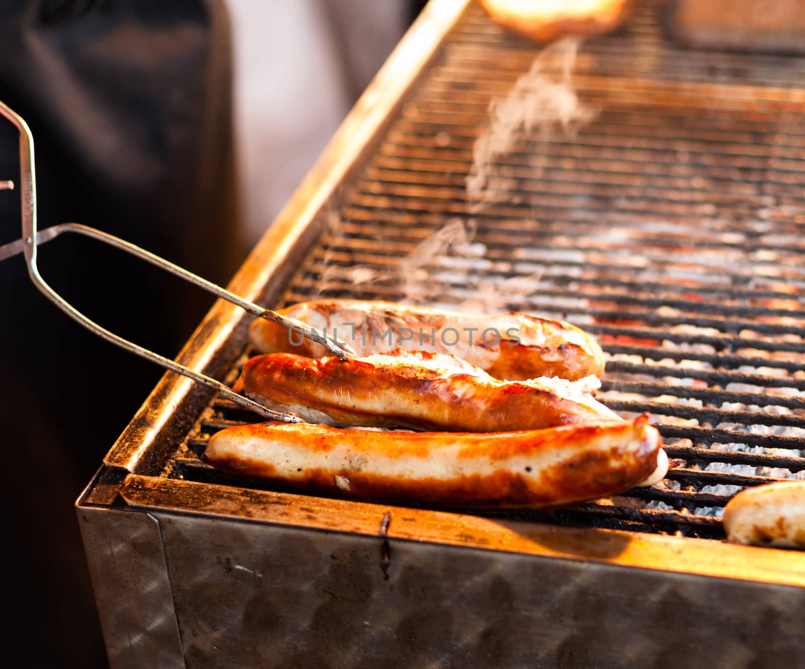 German sausages being grilled over coal outdoors