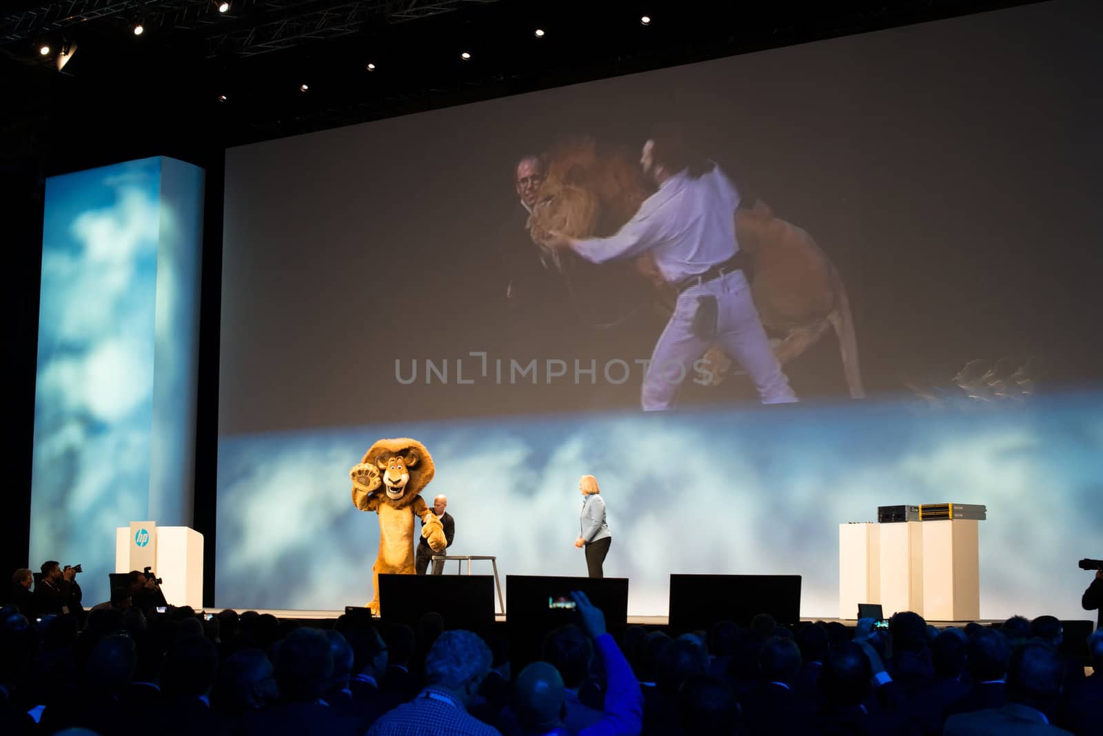 FRANKFURT – DECEMBER 4, 2012: HP president and CEO Meg Whitman delivers a keynote at HP Discover 2012 conference together with Dreamworks CEO Jeffrey Katzenberg and a cartoon character lion on December 4, 2012 in Frankfurt, Germany.