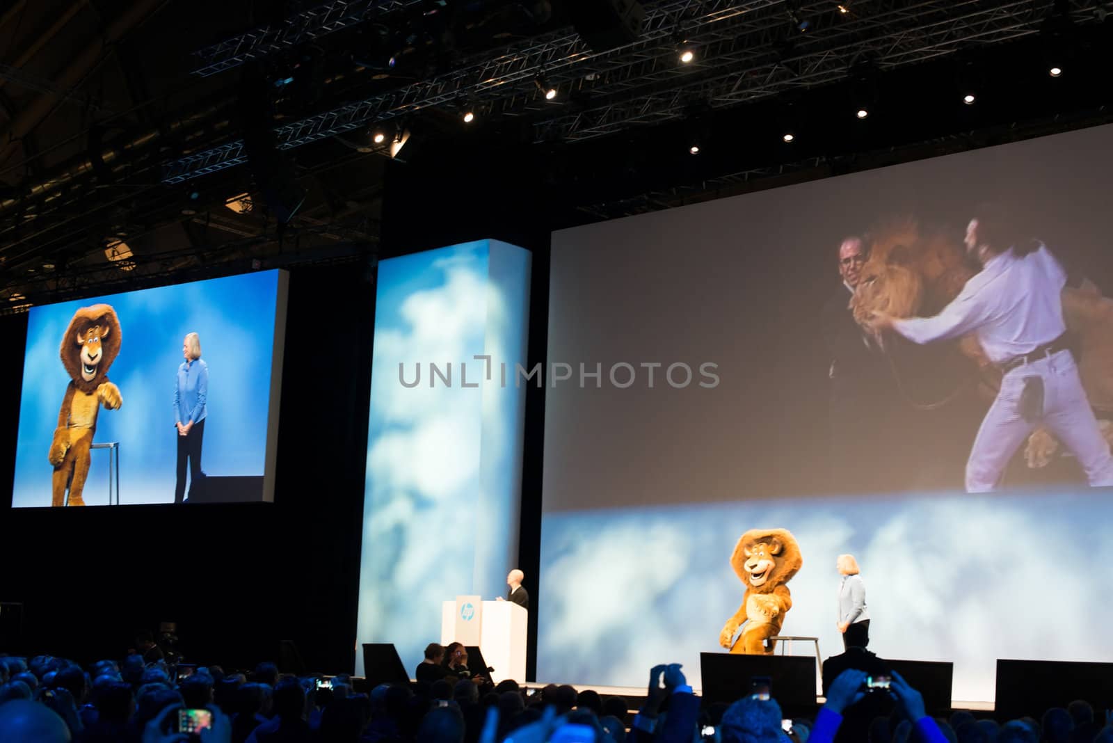 FRANKFURT – DECEMBER 4, 2012: HP president and CEO Meg Whitman delivers a keynote at HP Discover 2012 conference together with Dreamworks CEO Jeffrey Katzenberg and a cartoon character lion on December 4, 2012 in Frankfurt, Germany.