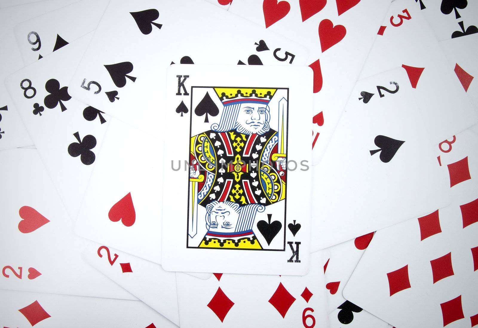 King card with playing cards background by geargodz