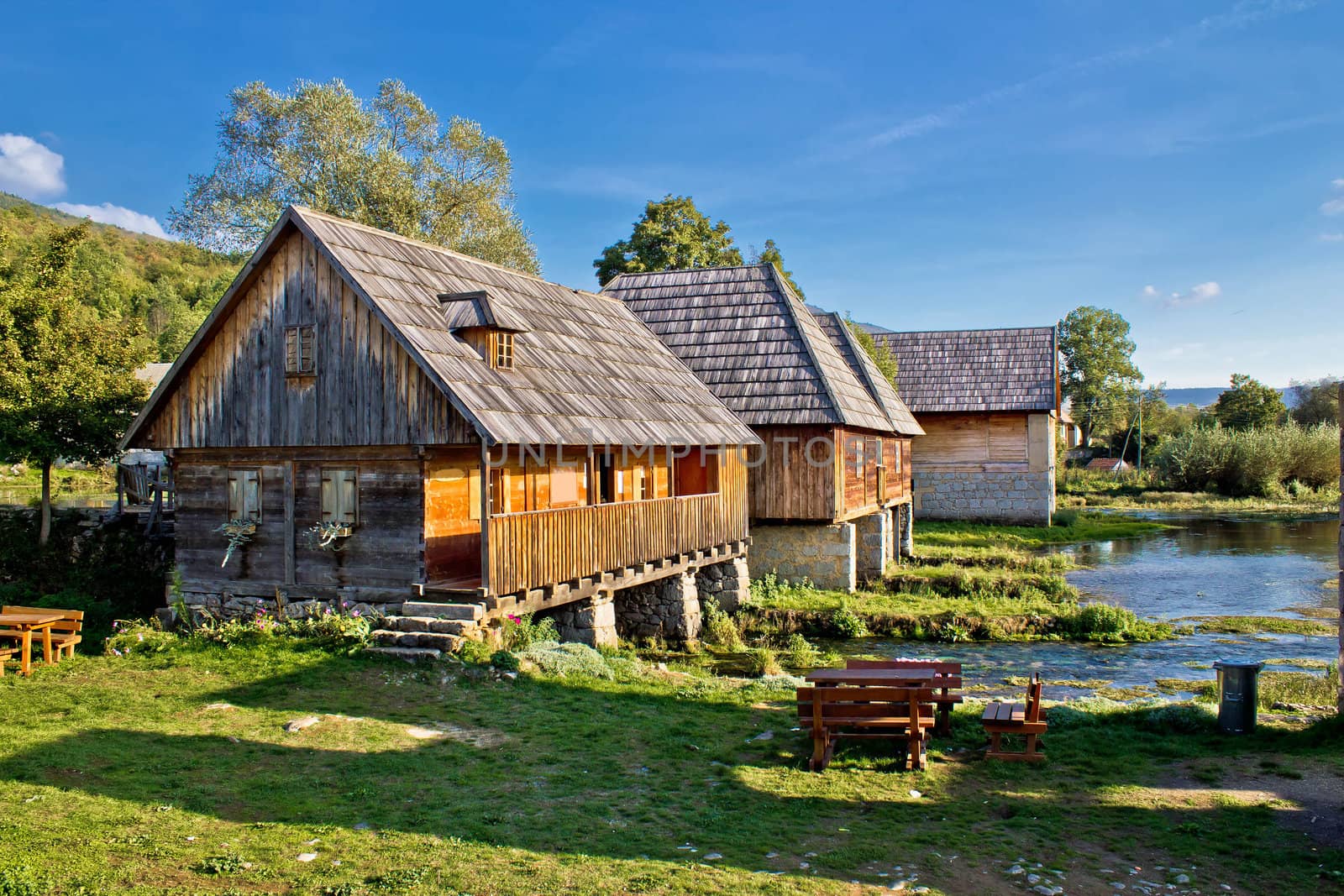 Old historic village with wooden cottages on Gacka river source, Majerovo vrilo, Lika, Croatia
