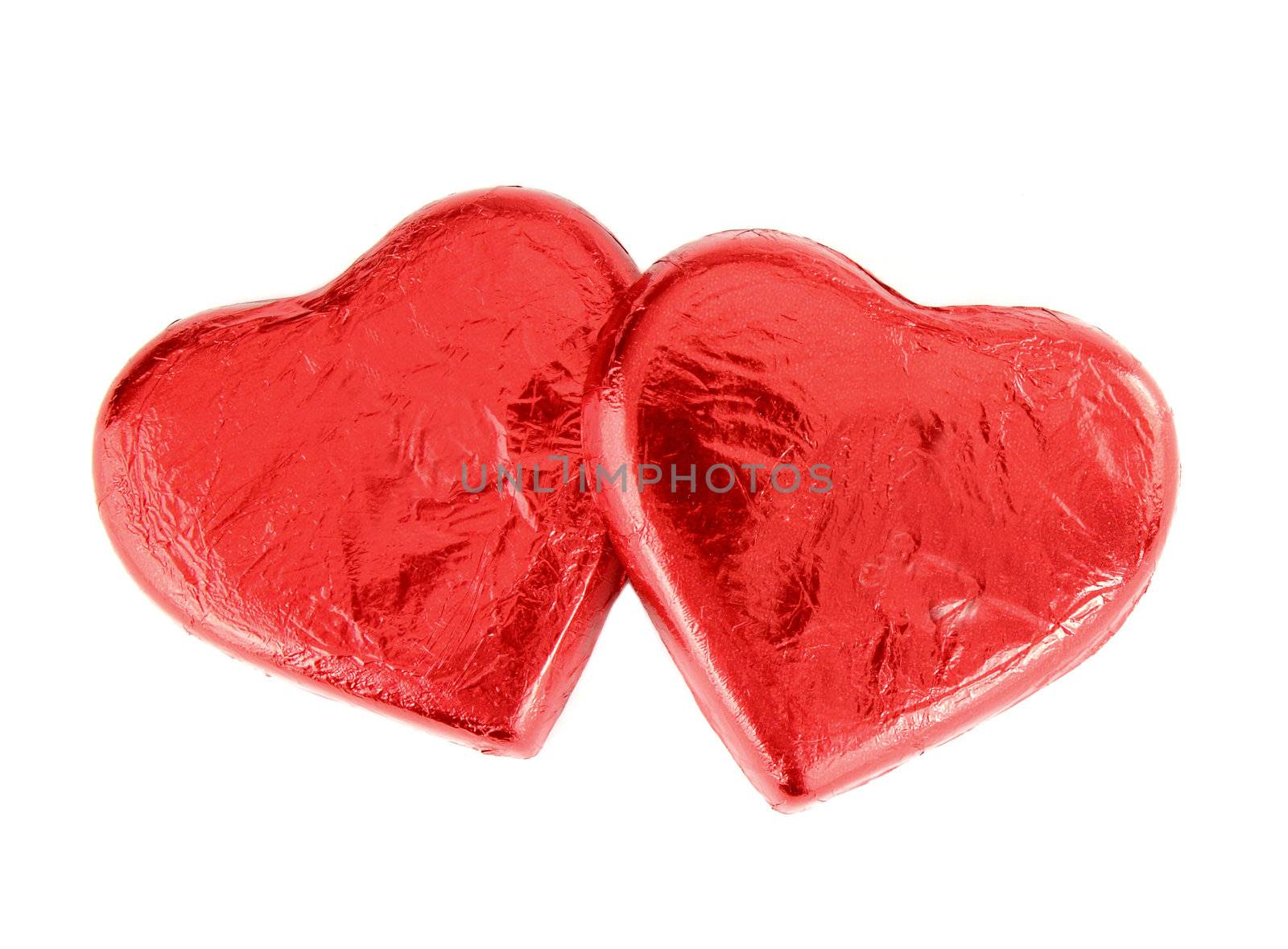 Red Foil wrapped chocolate hearts by geargodz