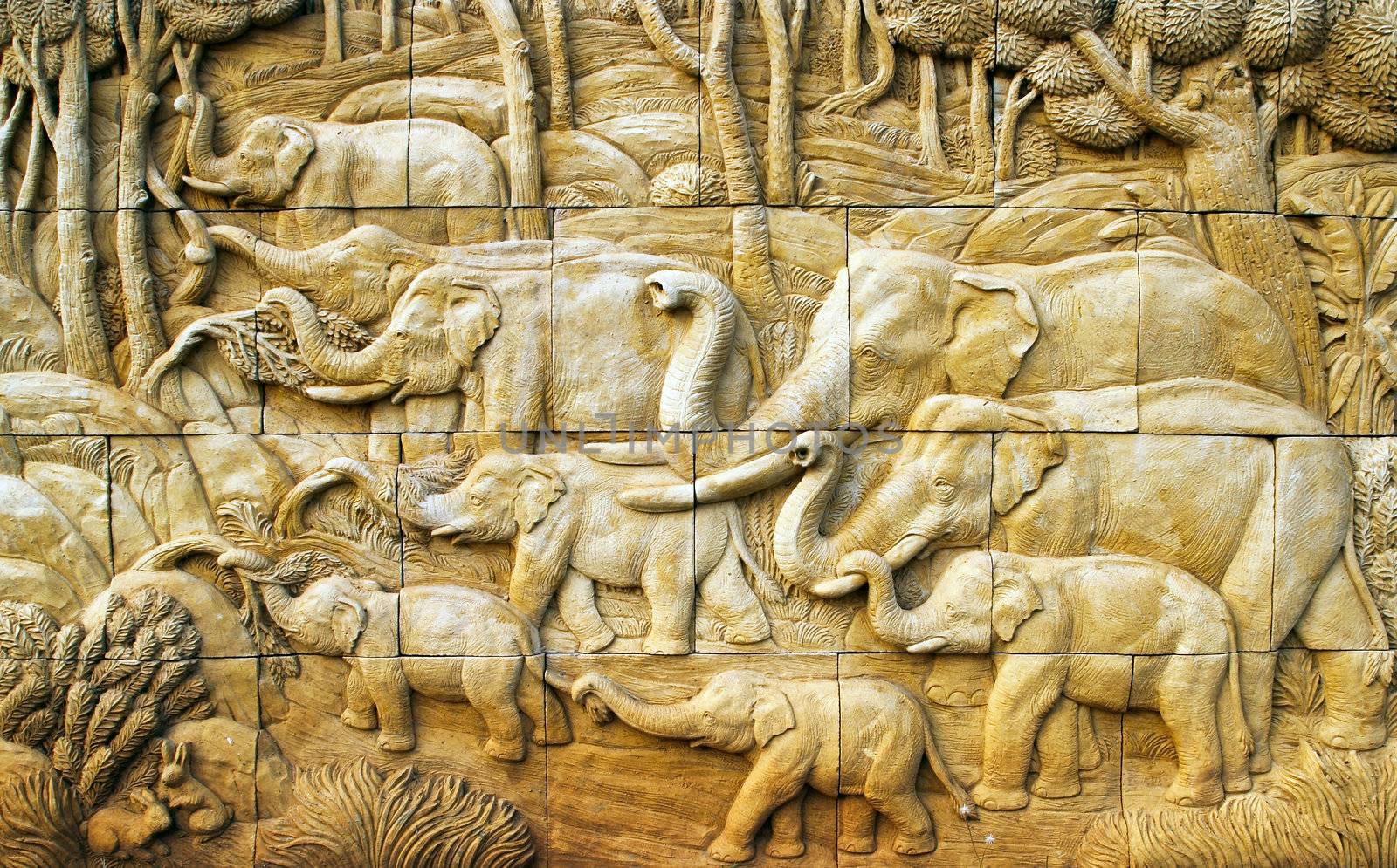 carved Elephant on stone wall by geargodz