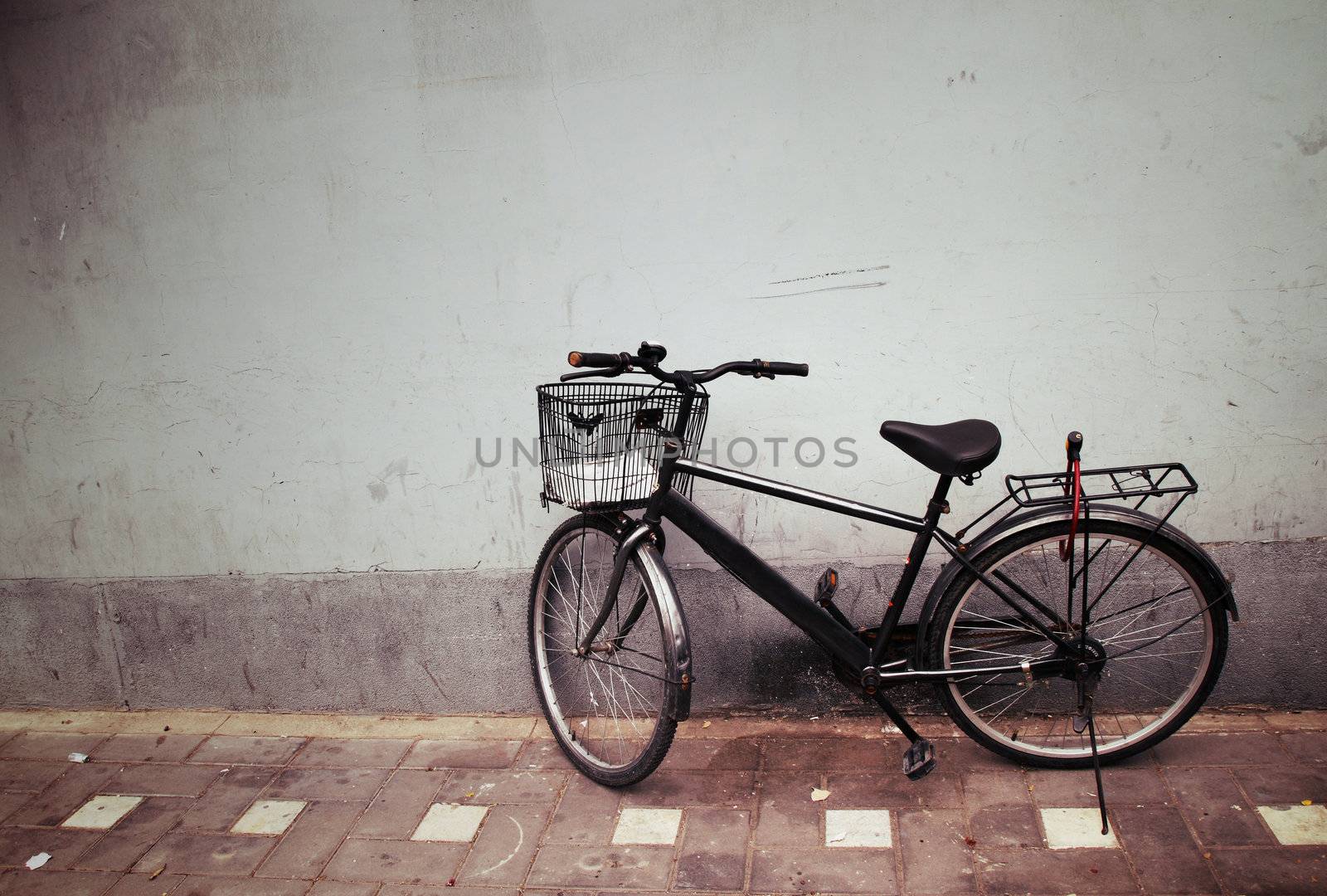 Old Bicycle against a Wall by geargodz