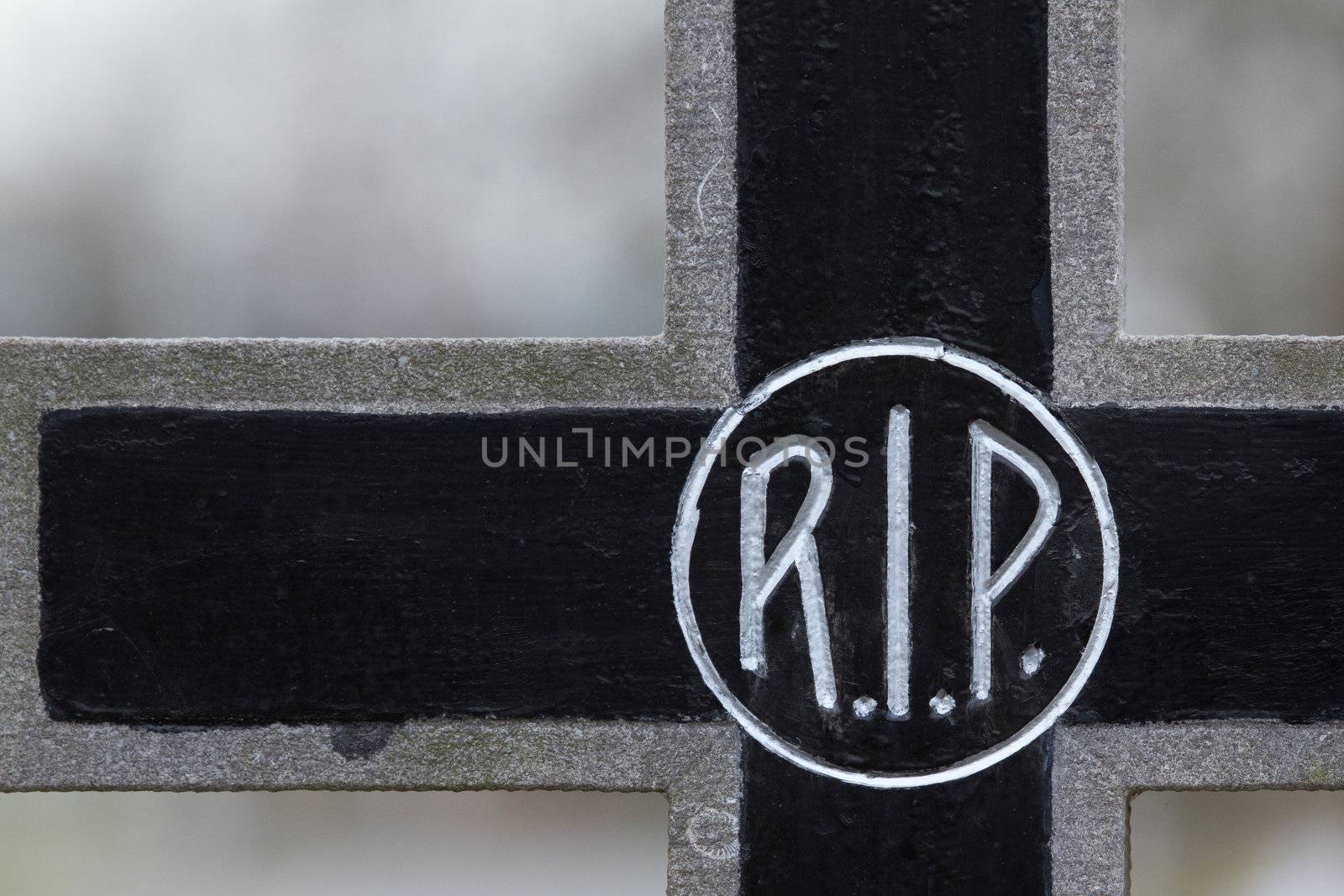 The letter RIP on an old marble grave in Holland