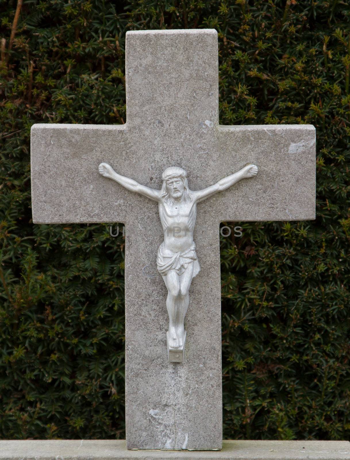 A statue of Jezus Chist on an old grave in Holland