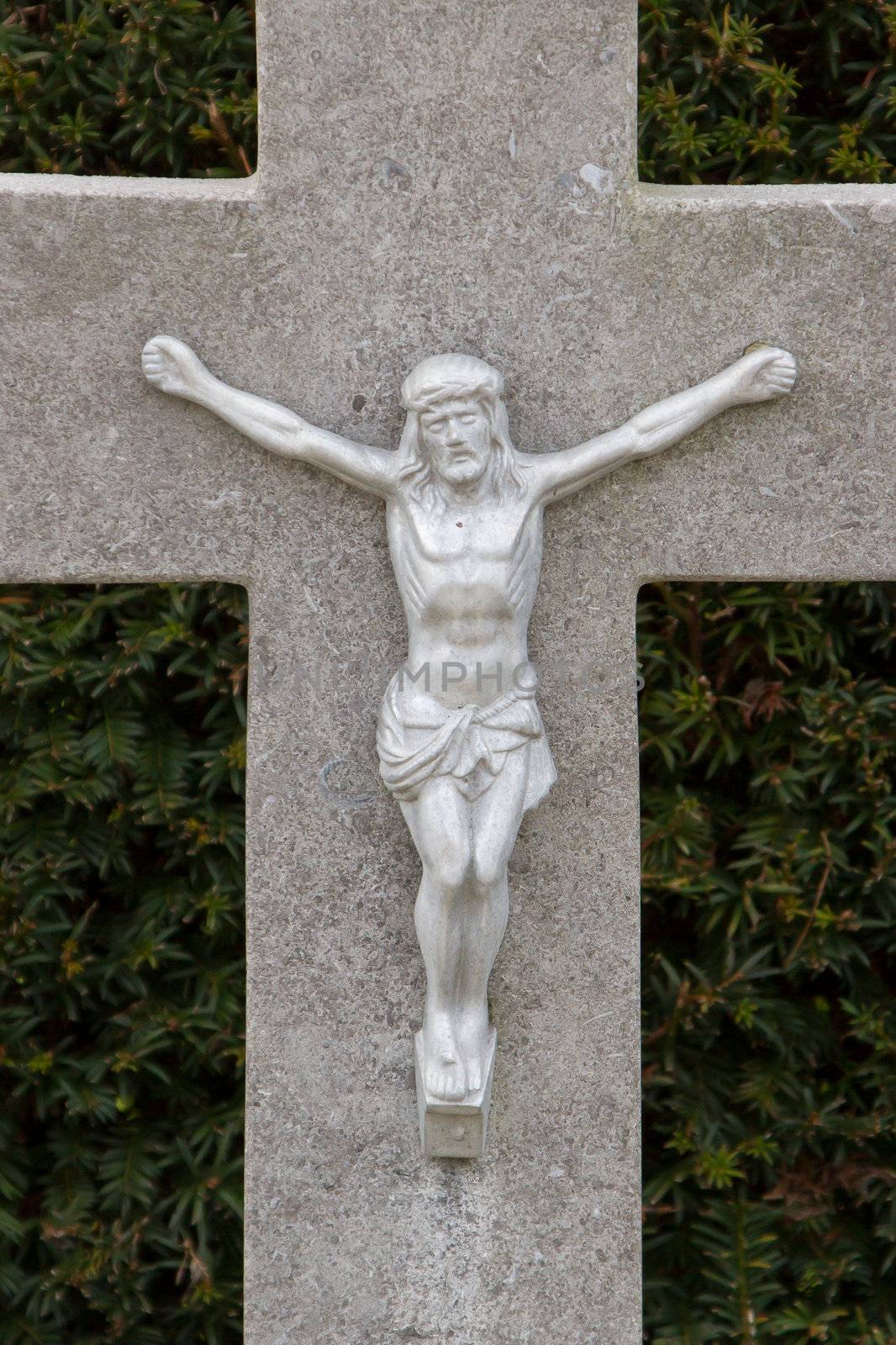 A statue of Jezus Chist on an old grave in Holland