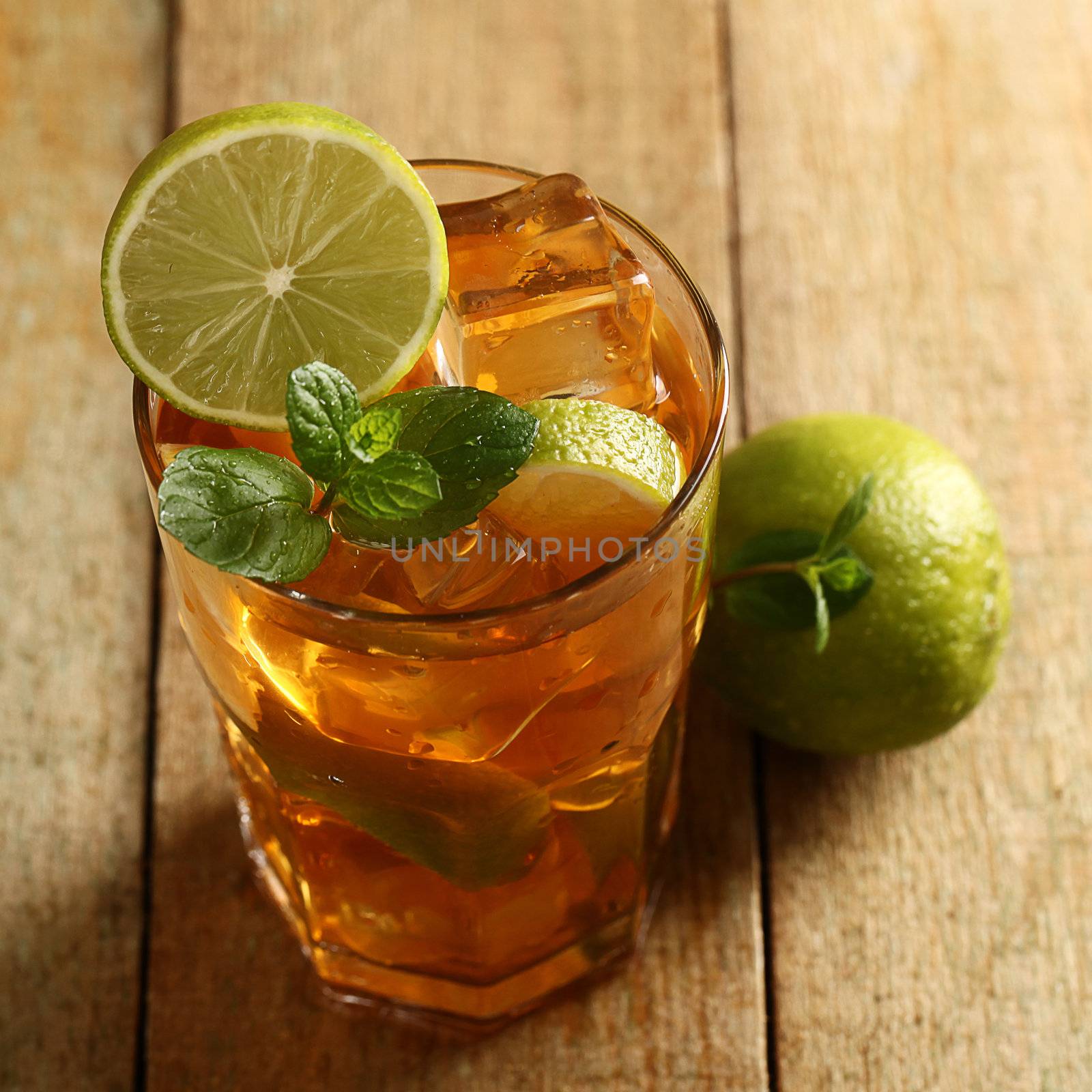 Fresh cold tea with lime, mint and lemon by rufatjumali