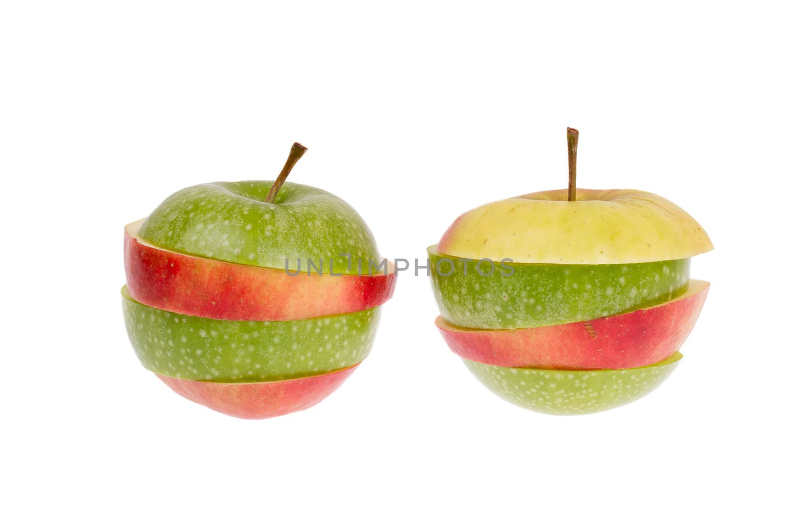 A sliced green and red apple isolated on a white background