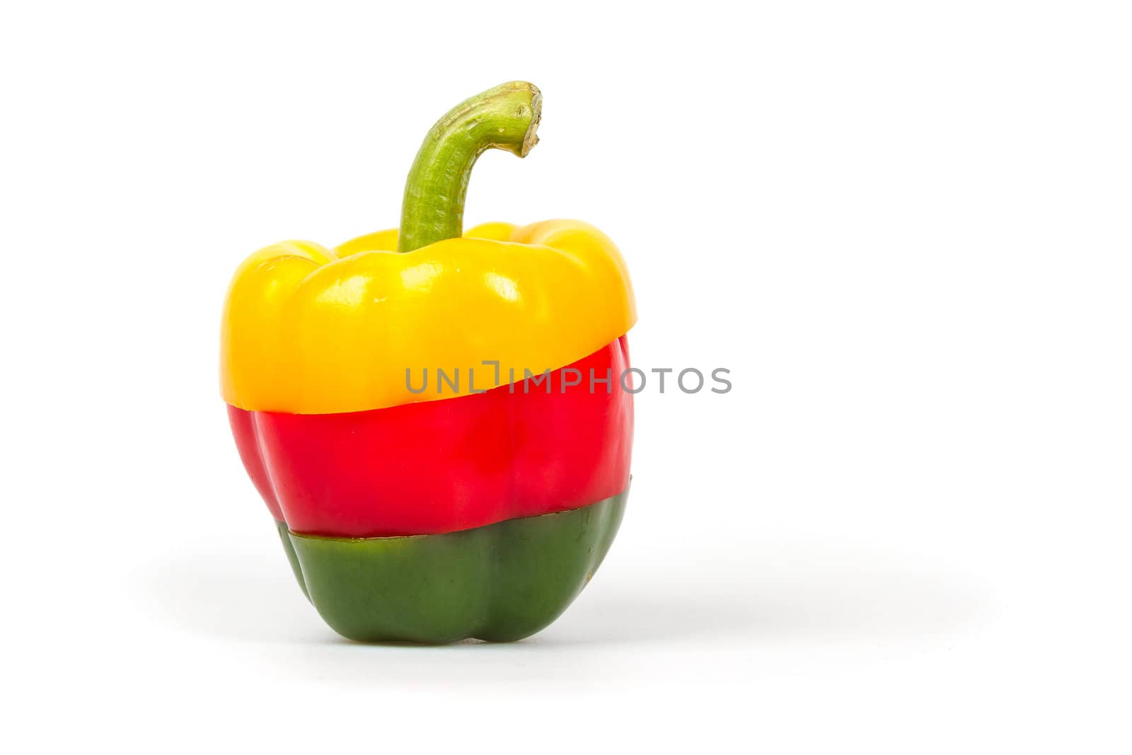 Slices of a green, red and yellow pepper put together