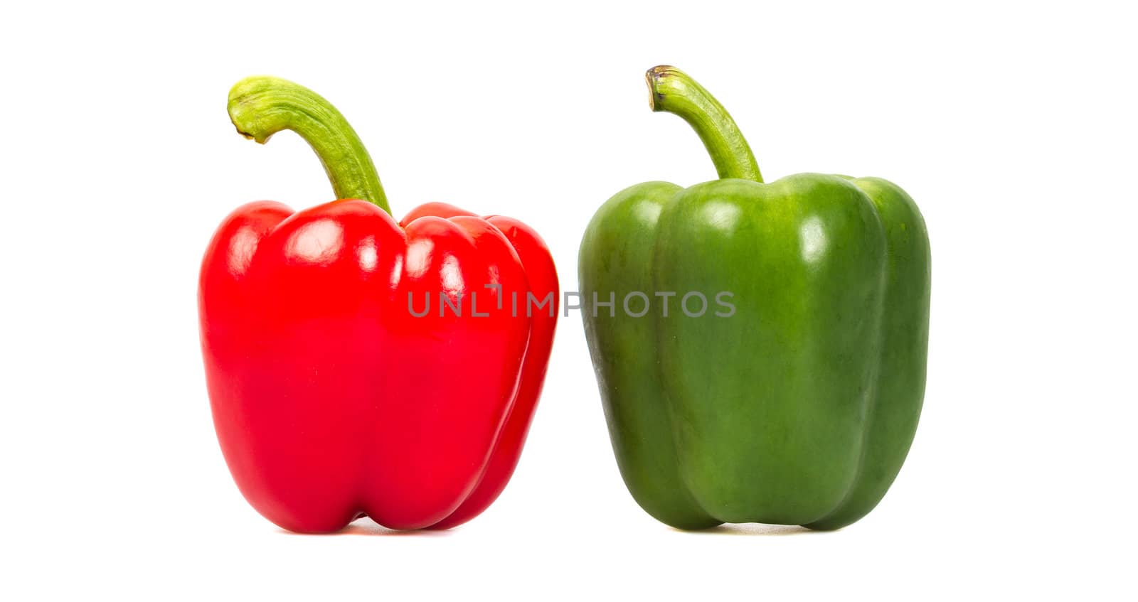 Green and red pepper isolated on a white background