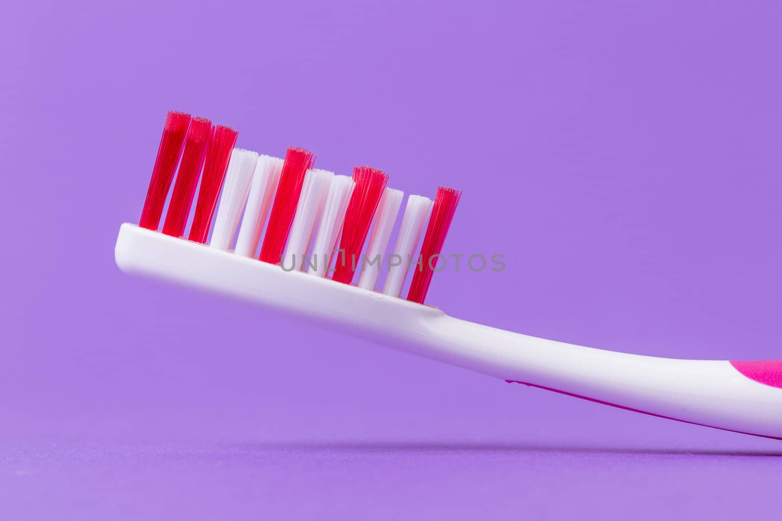 A pink toothbrush by michaklootwijk