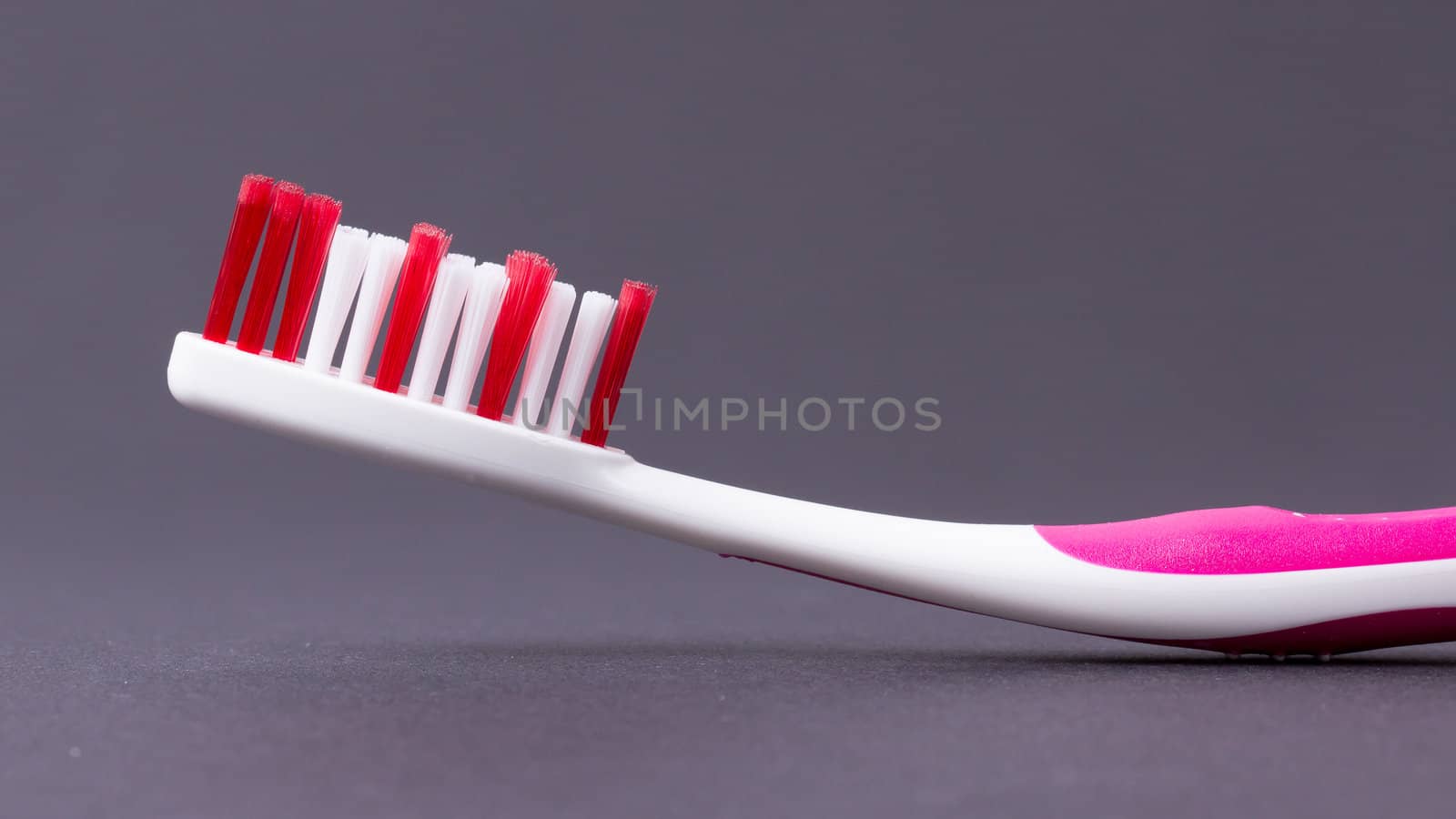 A pink toothbrush by michaklootwijk
