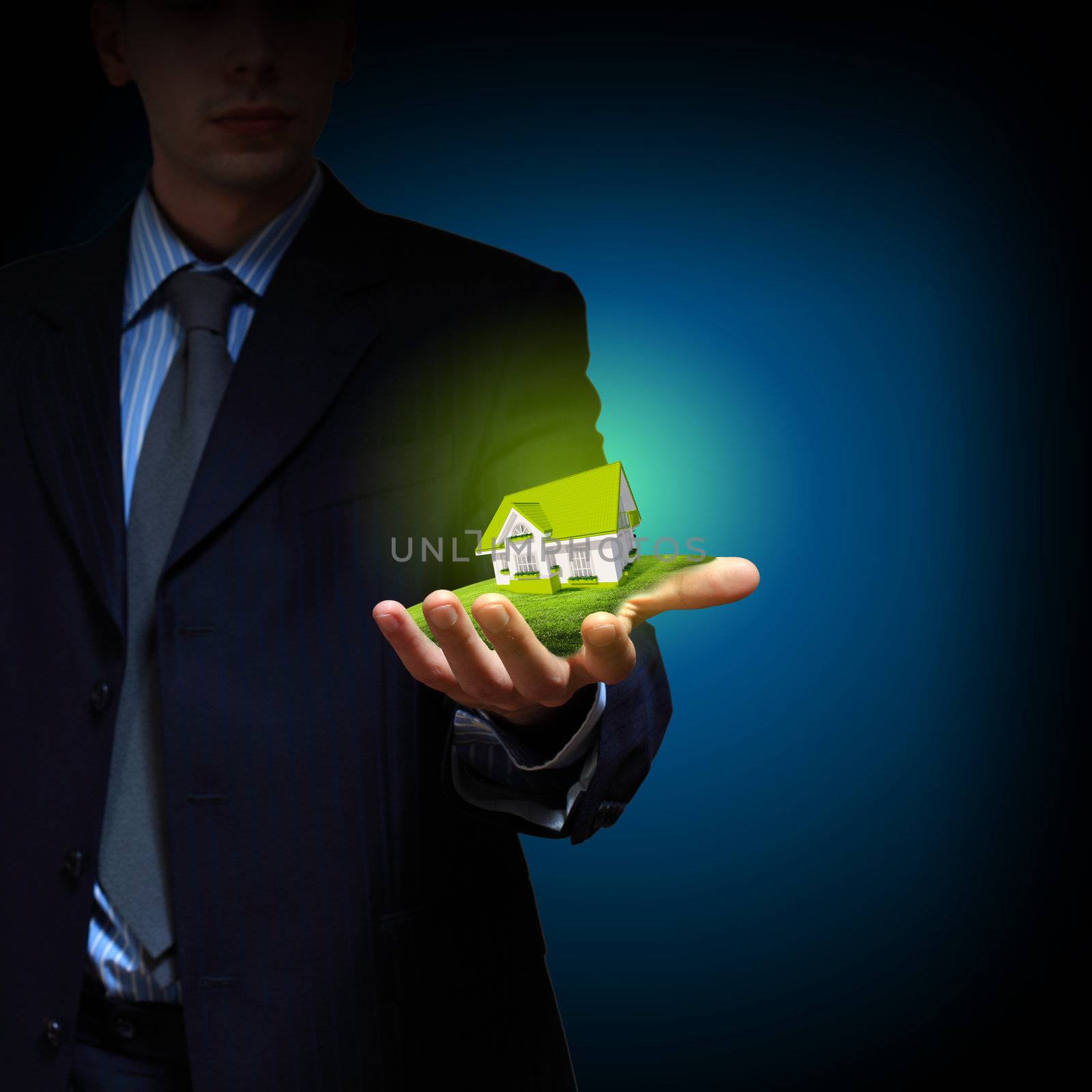 Residential building and a businessman holding it in his hands