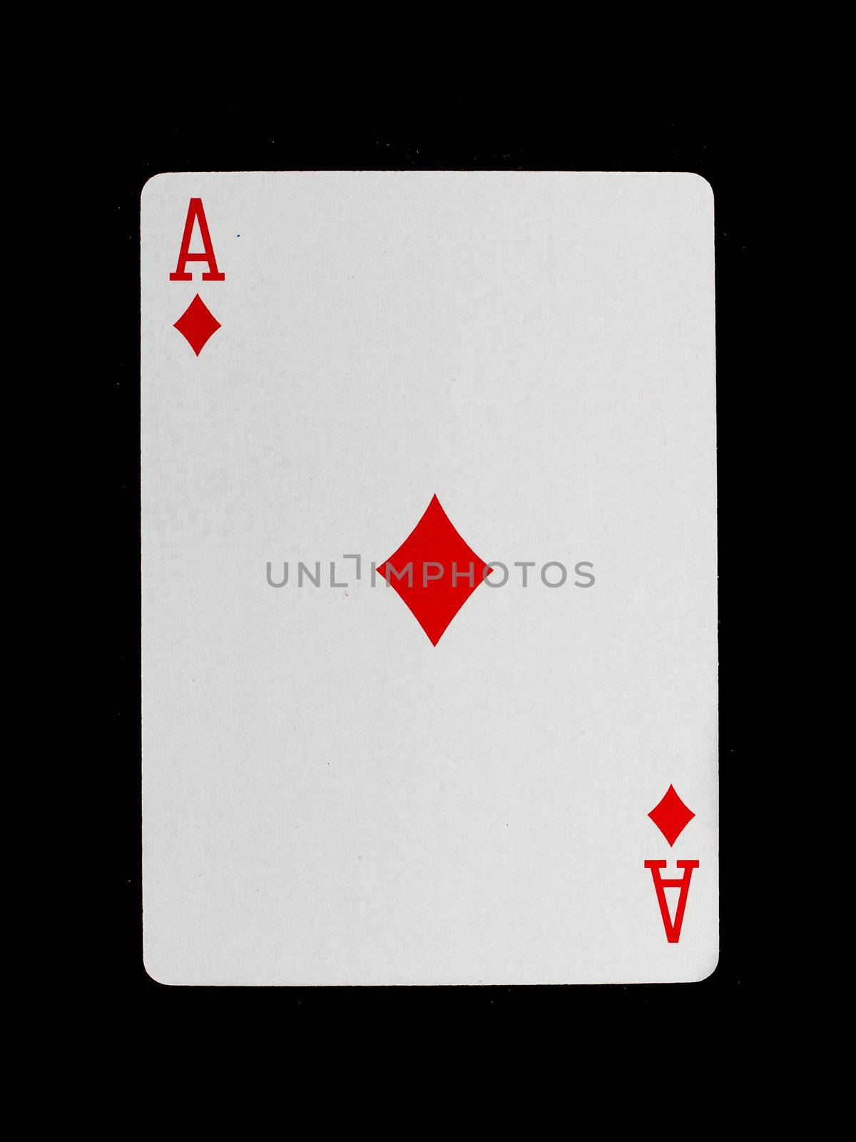 Old playing card (ace) isolated on a black background