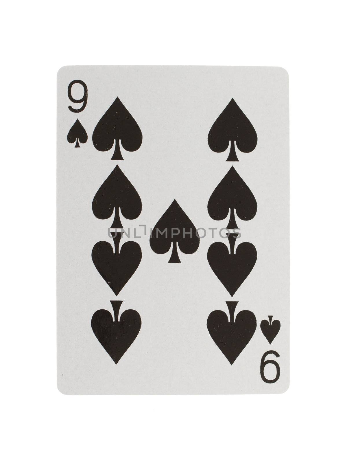 Old playing card (nine) isolated on a white background