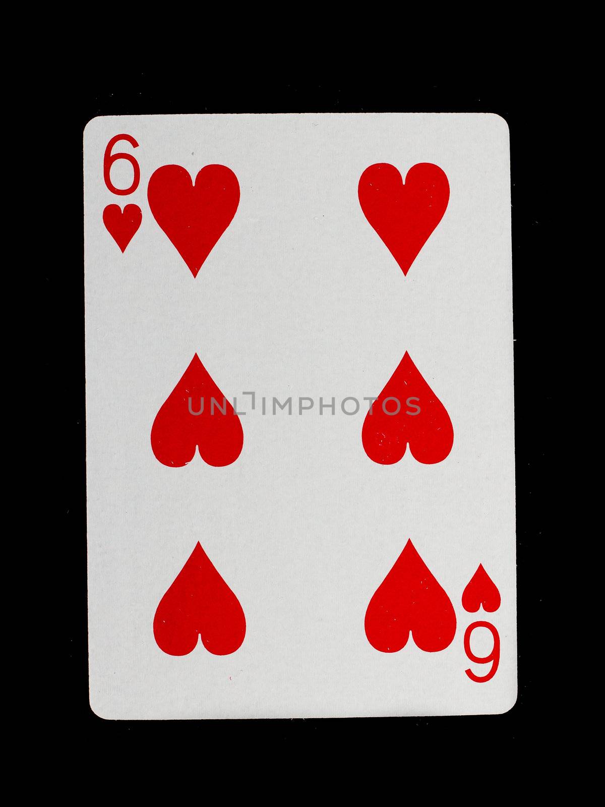 Playing card (six) isolated on a black background